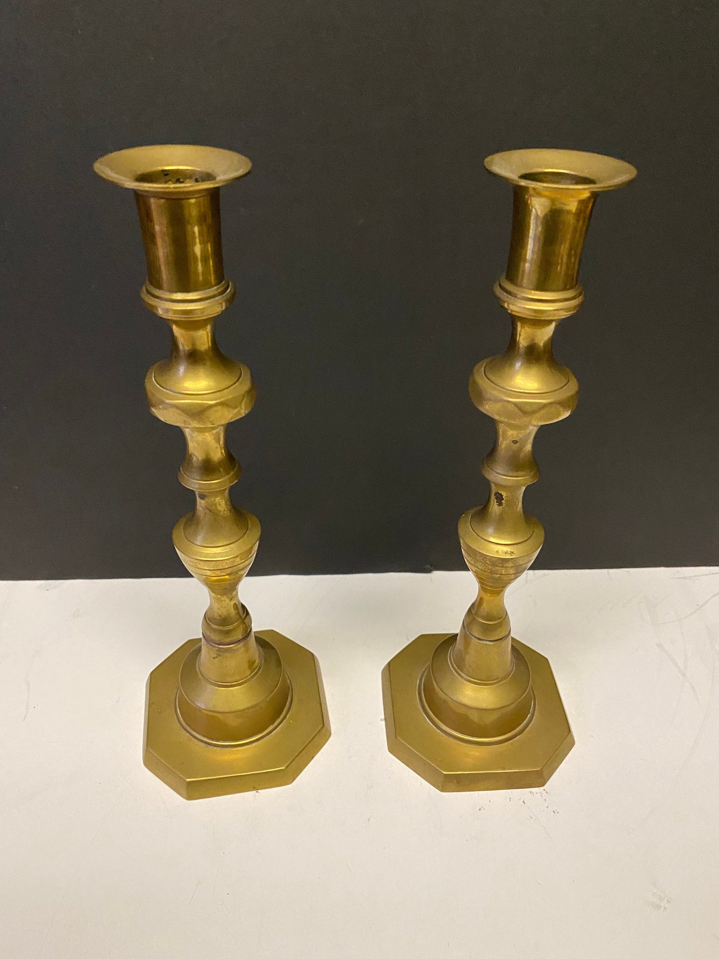 A  Pair heavy heavy brass Antique candlesticks 10 inches tall  Good quality  over 1kg