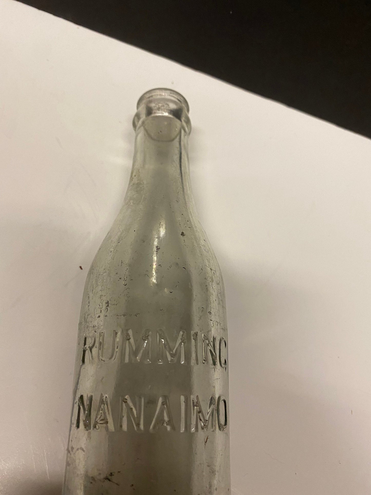 A  8 inch rumming nanaimo clear bottle  Canadian island bottle history  Dirty but good condition rare