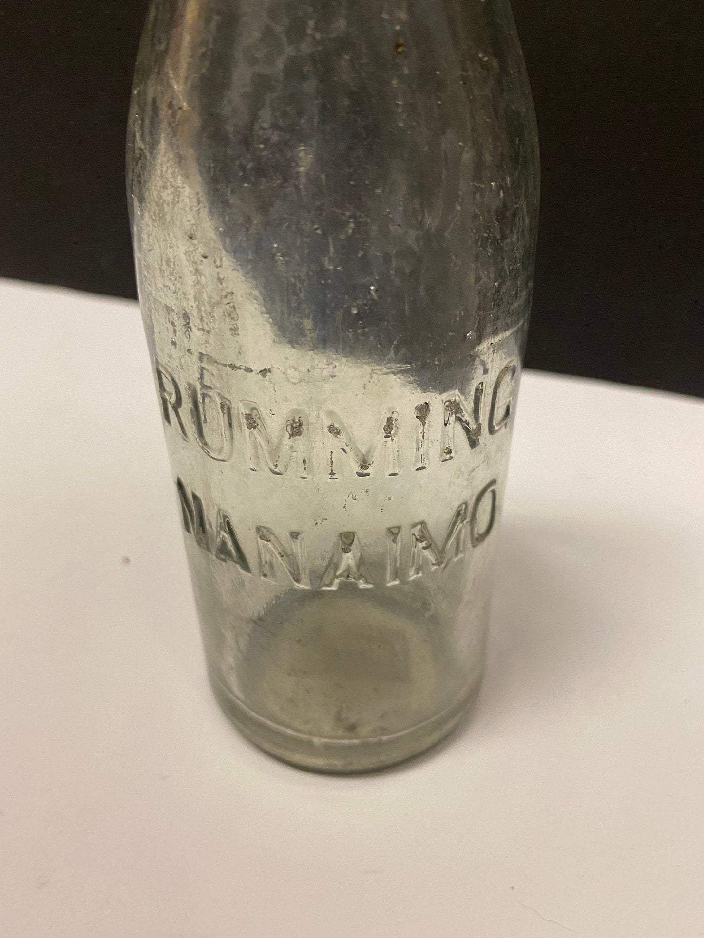 A  8 inch rumming nanaimo clear bottle  Canadian island bottle history  Dirty but good condition rare
