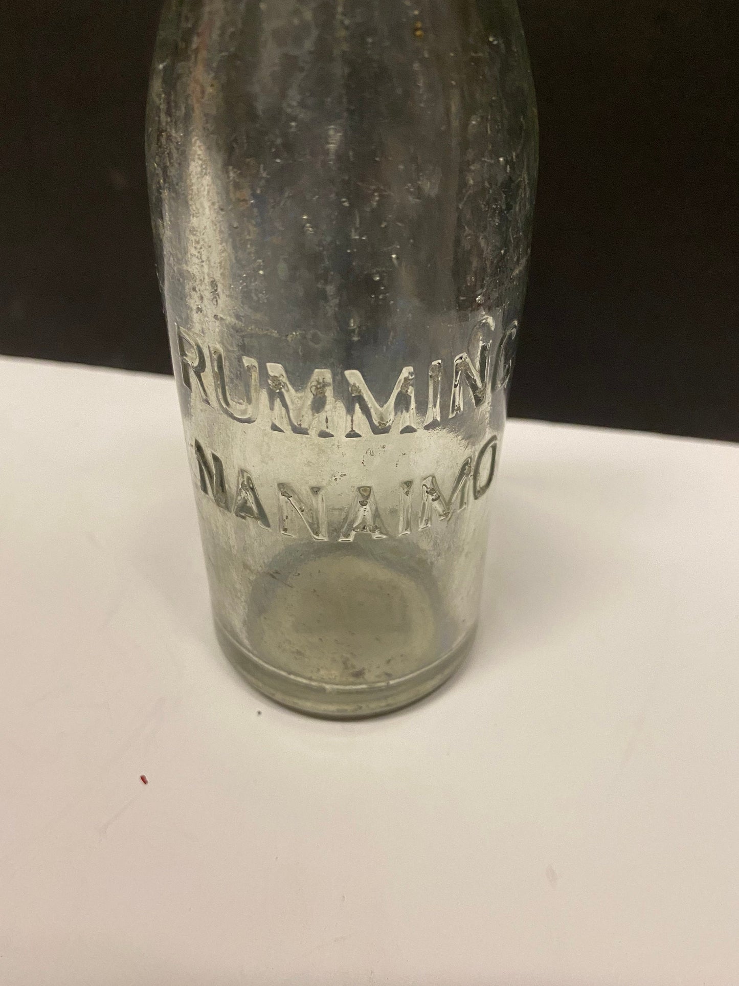 A  8 inch rumming nanaimo clear bottle  Canadian island bottle history  Dirty but good condition rare