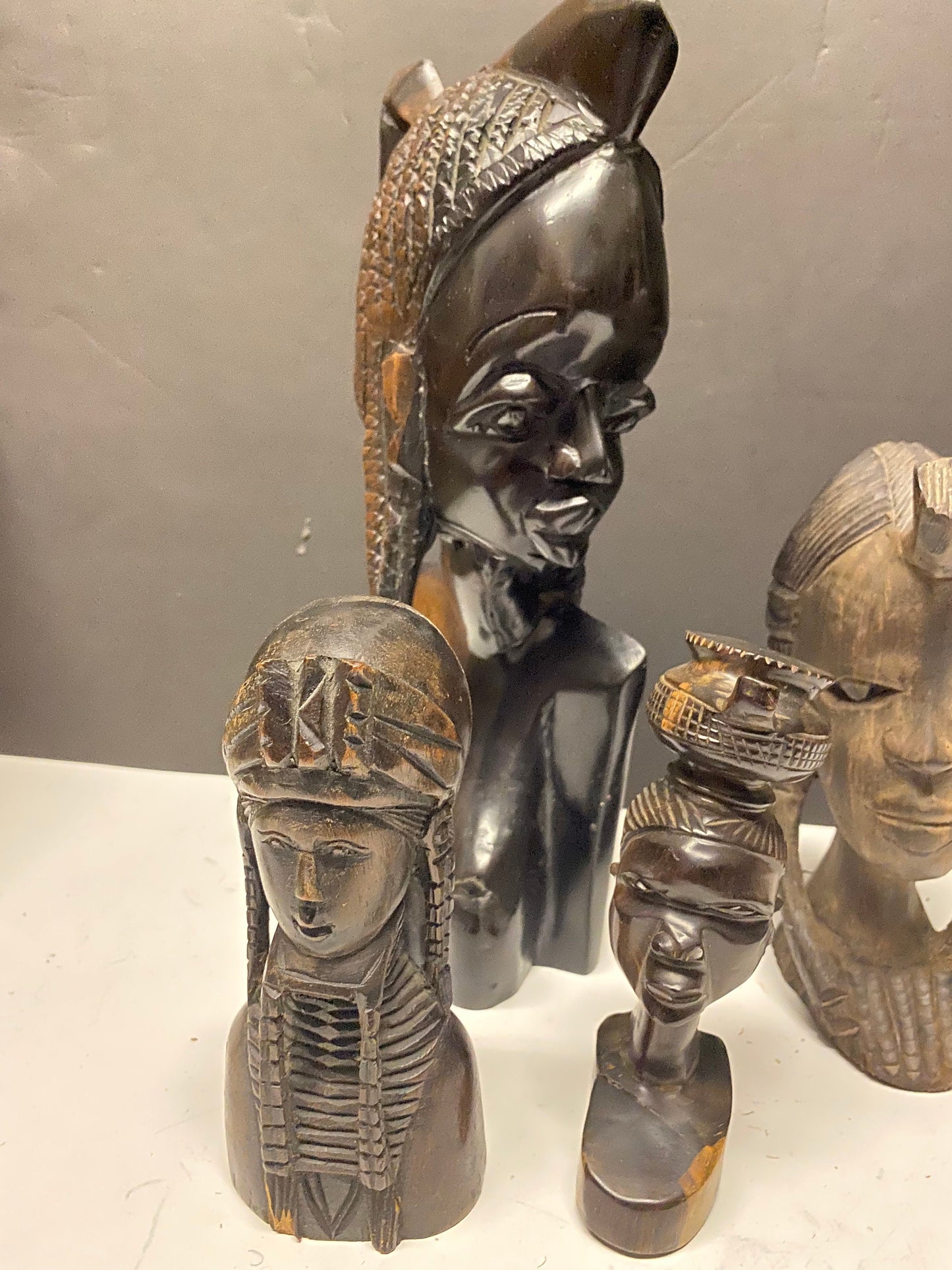 A  Collection of four wonderful hardwood ebony African female busts  6 to 13 inches  1500g of carved wood  wow wow wow