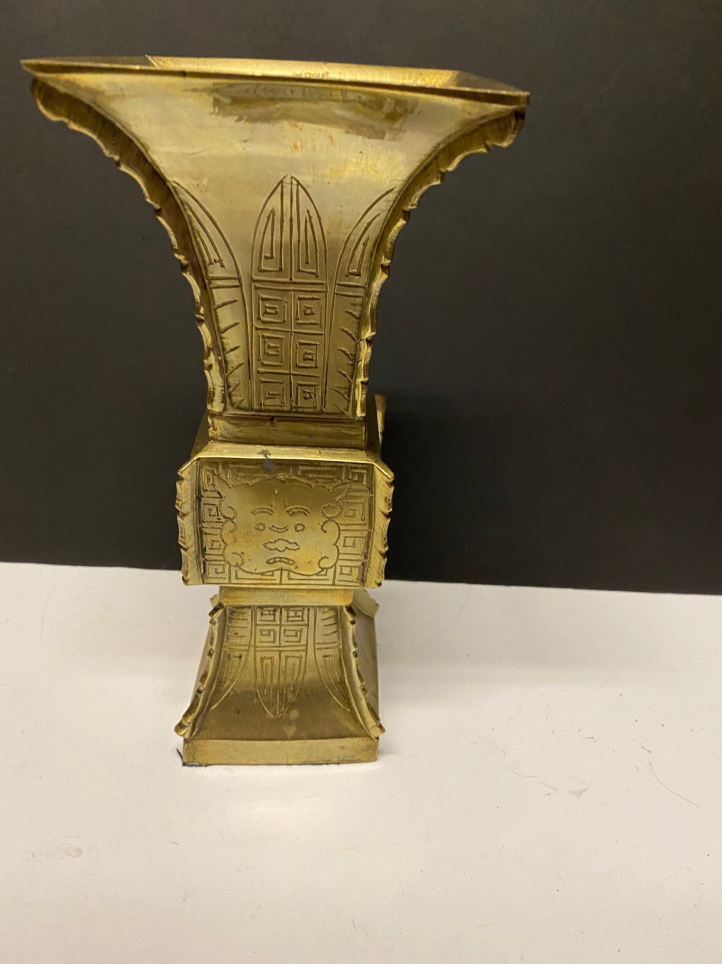 9 inch heavy Chinese brass vase with Chinese temple guardian faces  730 grams  lovely quality