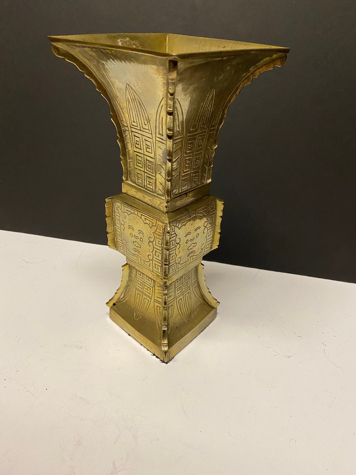 9 inch heavy Chinese brass vase with Chinese temple guardian faces  730 grams  lovely quality