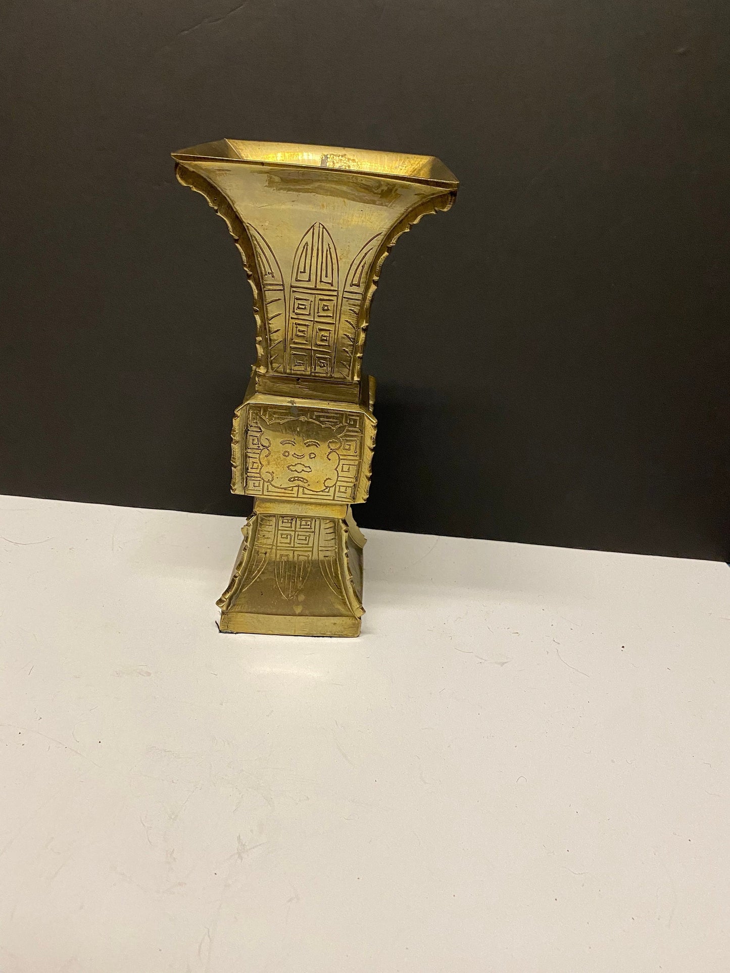 9 inch heavy Chinese brass vase with Chinese temple guardian faces  730 grams  lovely quality