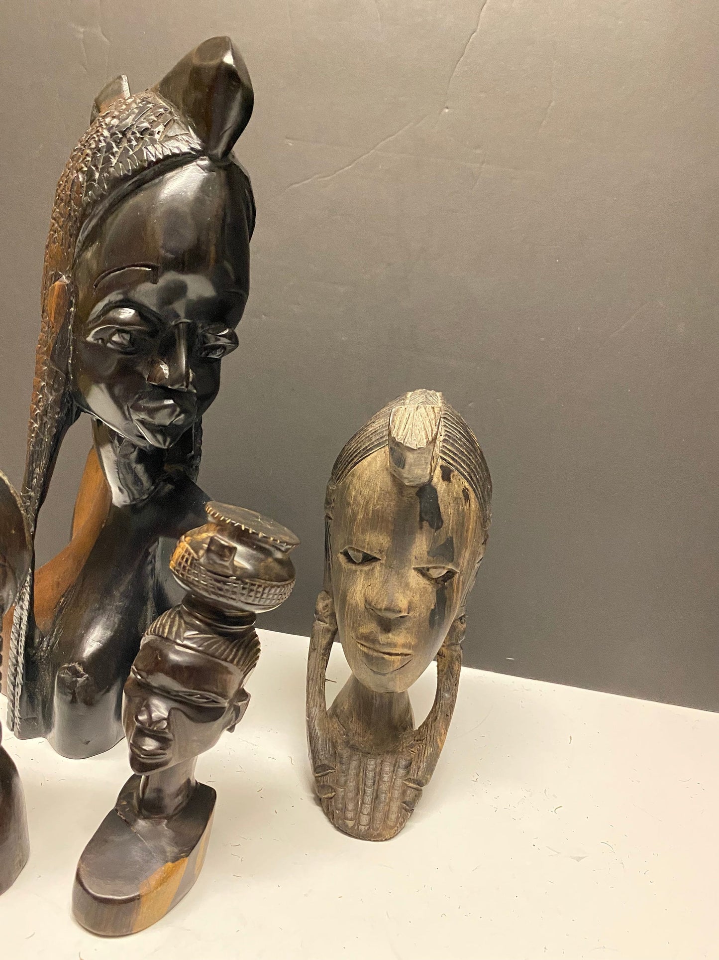 A  Collection of four wonderful hardwood ebony African female busts  6 to 13 inches  1500g of carved wood  wow wow wow