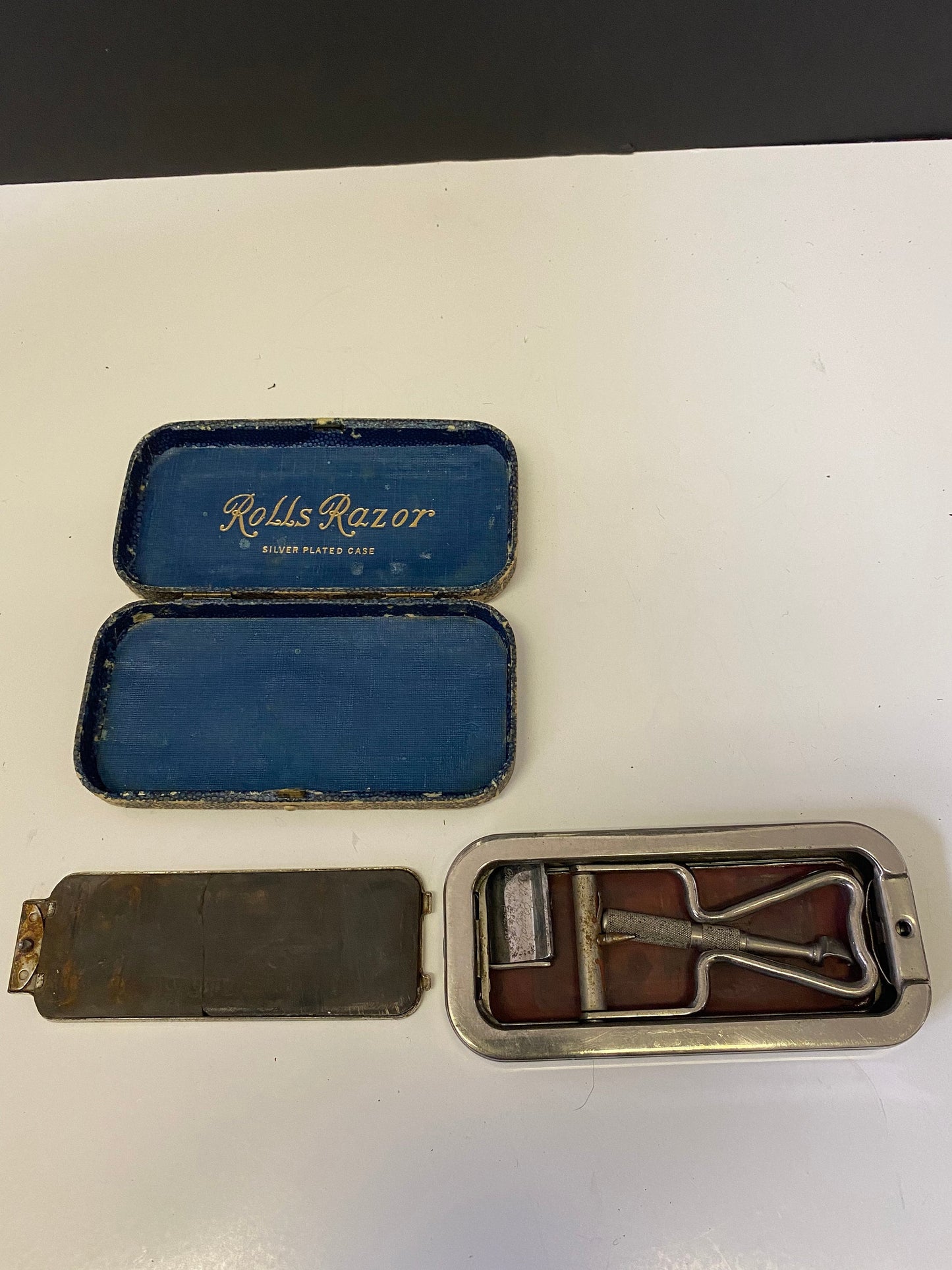 An  Antique rolls razor set in silver plated case  in original case  antique condition  great decoration  gift for  your barber
