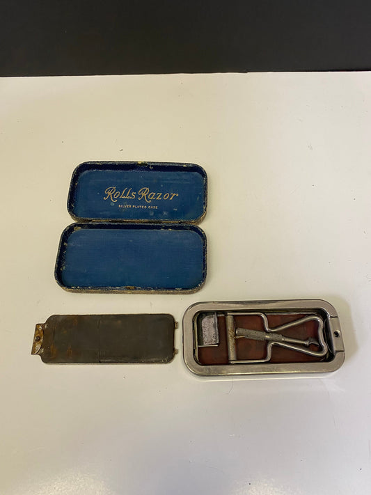 An  Antique rolls razor set in silver plated case  in original case  antique condition  great decoration  gift for  your barber