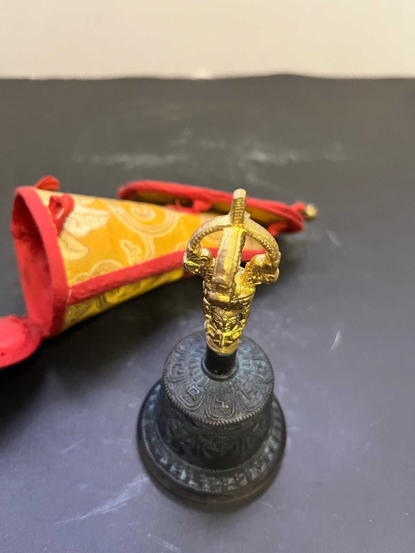 Stunning 5 inch southeast Asian bronze and  gilded bell on great condition with original silk carrying case  nice sound, and a great gift
