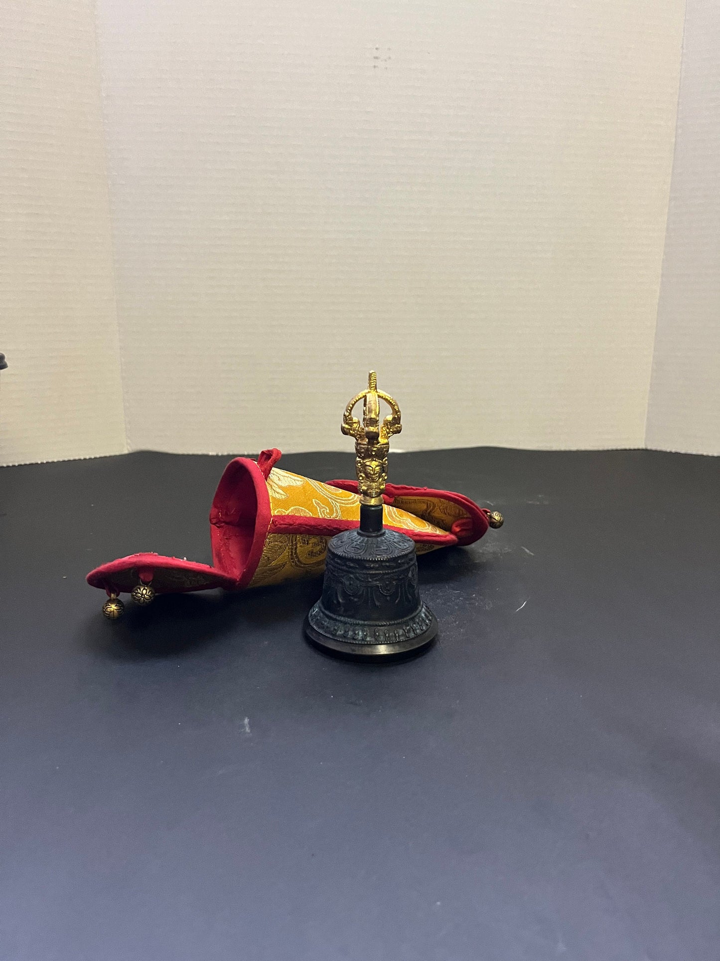 Stunning 5 inch southeast Asian bronze and  gilded bell on great condition with original silk carrying case  nice sound, and a great gift