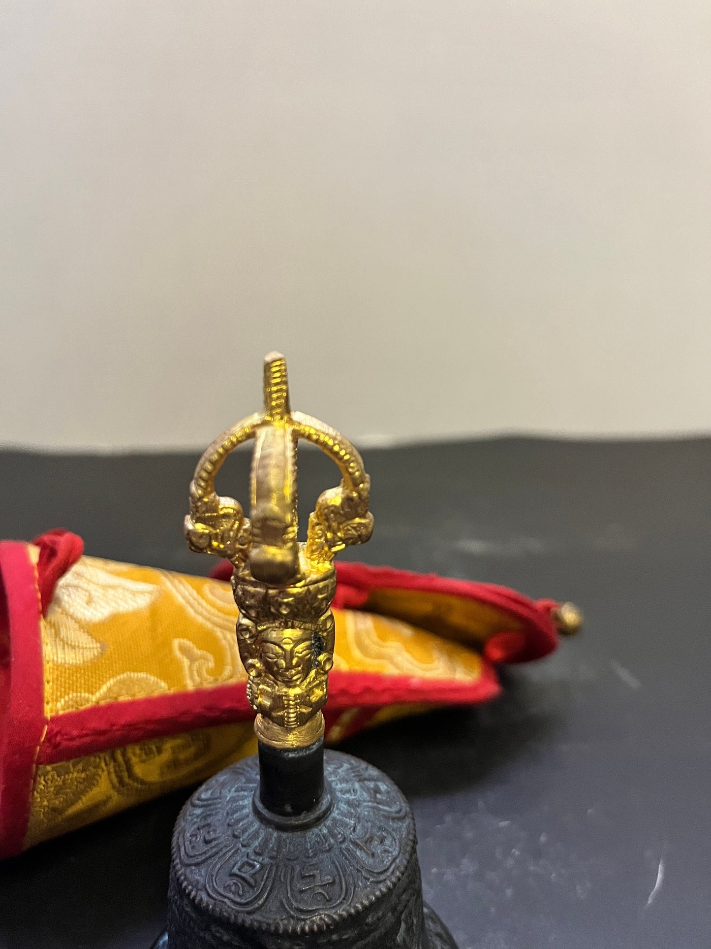 Stunning 5 inch southeast Asian bronze and  gilded bell on great condition with original silk carrying case  nice sound, and a great gift