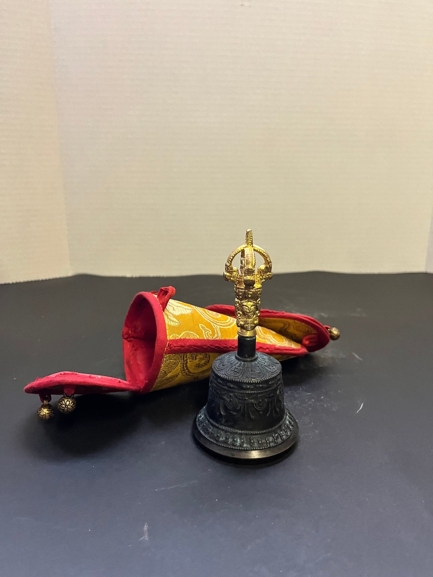 Stunning 5 inch southeast Asian bronze and  gilded bell on great condition with original silk carrying case  nice sound, and a great gift