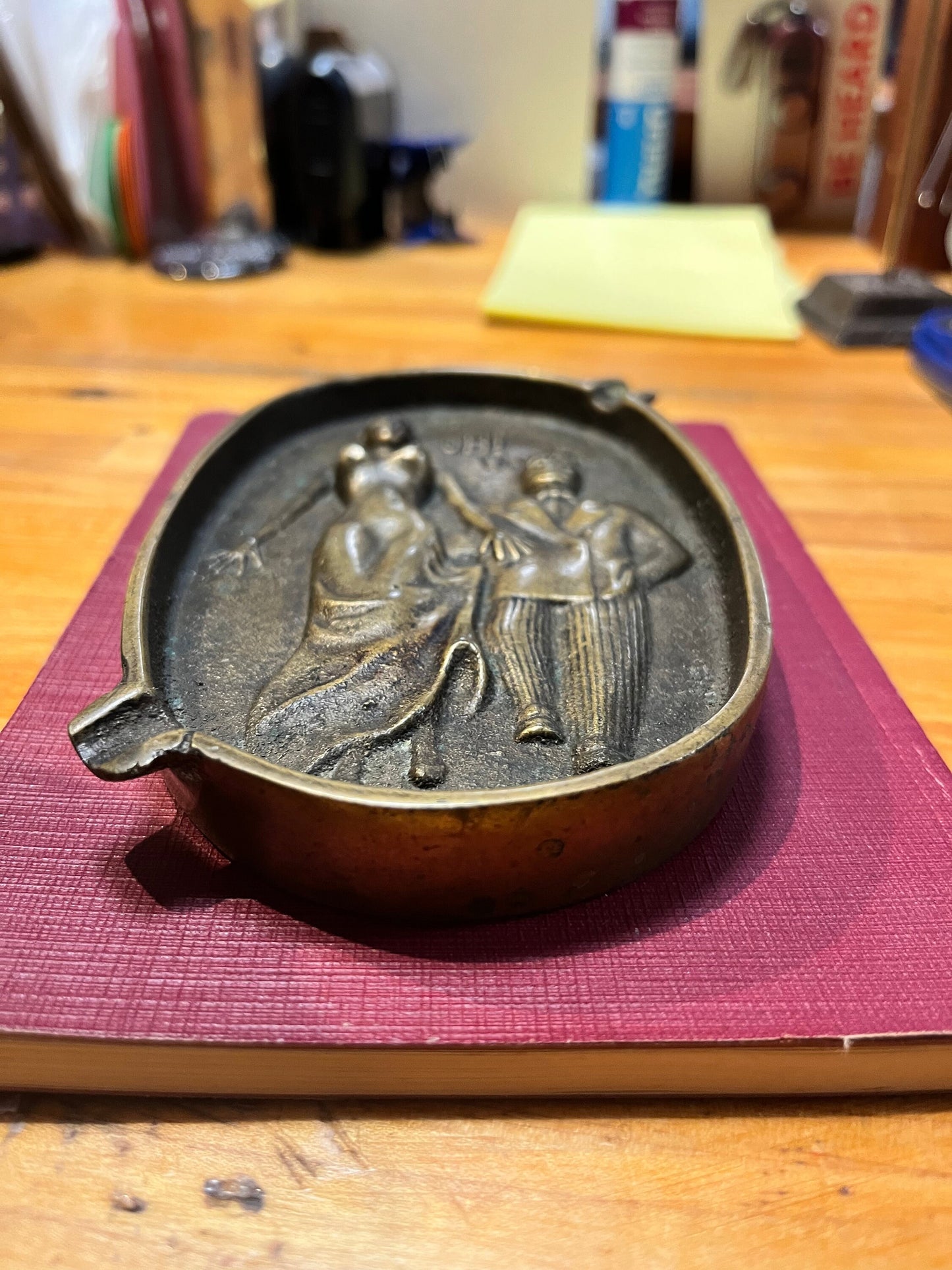 5.5 inch long  antique naughty bronze ashtray  amazing patina and such a cool piece.