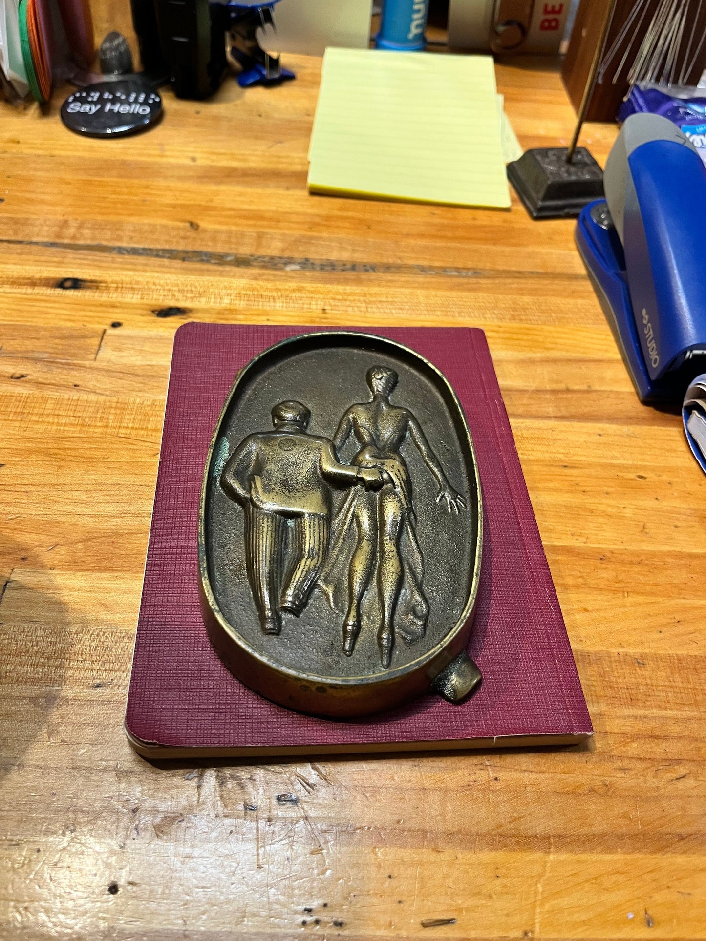 5.5 inch long  antique naughty bronze ashtray  amazing patina and such a cool piece.