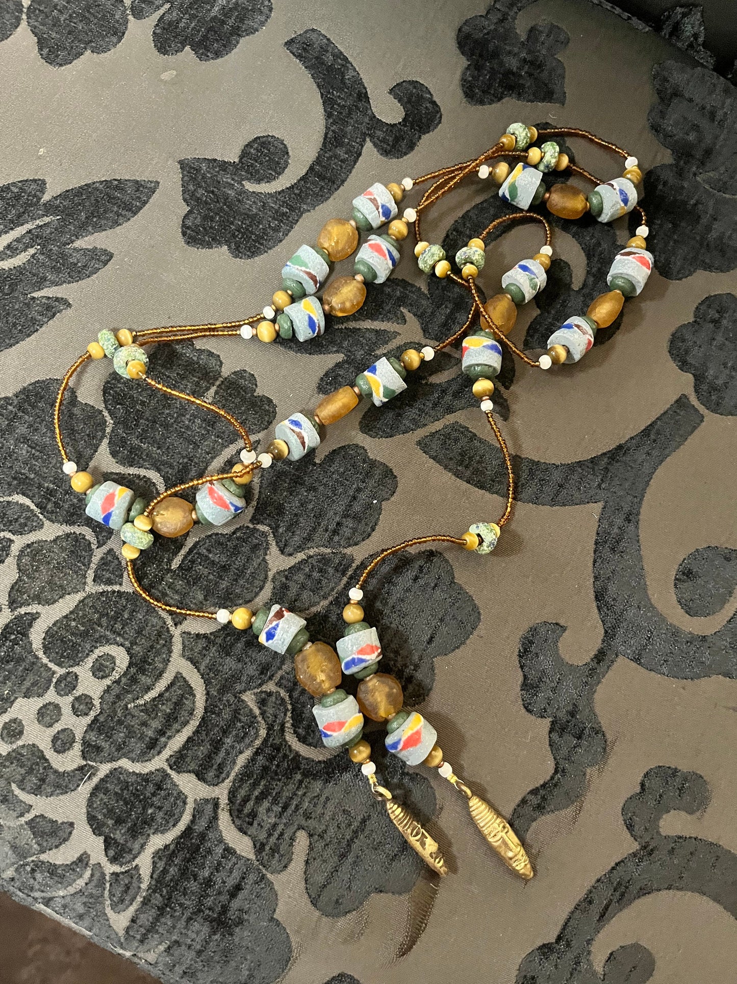 Absolutely epic African  approx  65 inch long stone and beaded necklace  bronze masks on ends  wow wow  tribal beauty