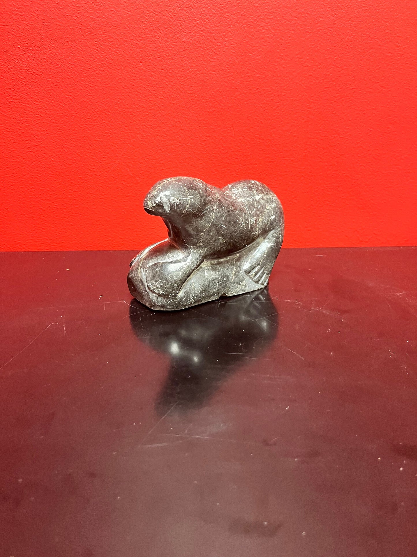 Antique indigenous Inuit, 7 x 4 stunning, soapstone hunting seal  with sticker and number  wow  good antique condition
