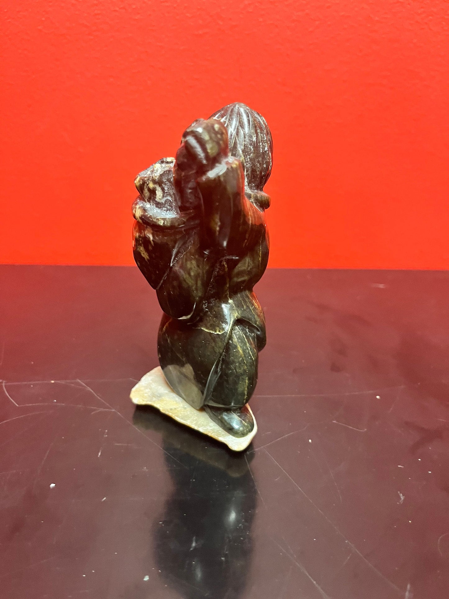 Beautiful 6 inch tall, vintage, indigenous, Inuit soap, stone statue of a hunter carrying child on Stone base   delicious piece