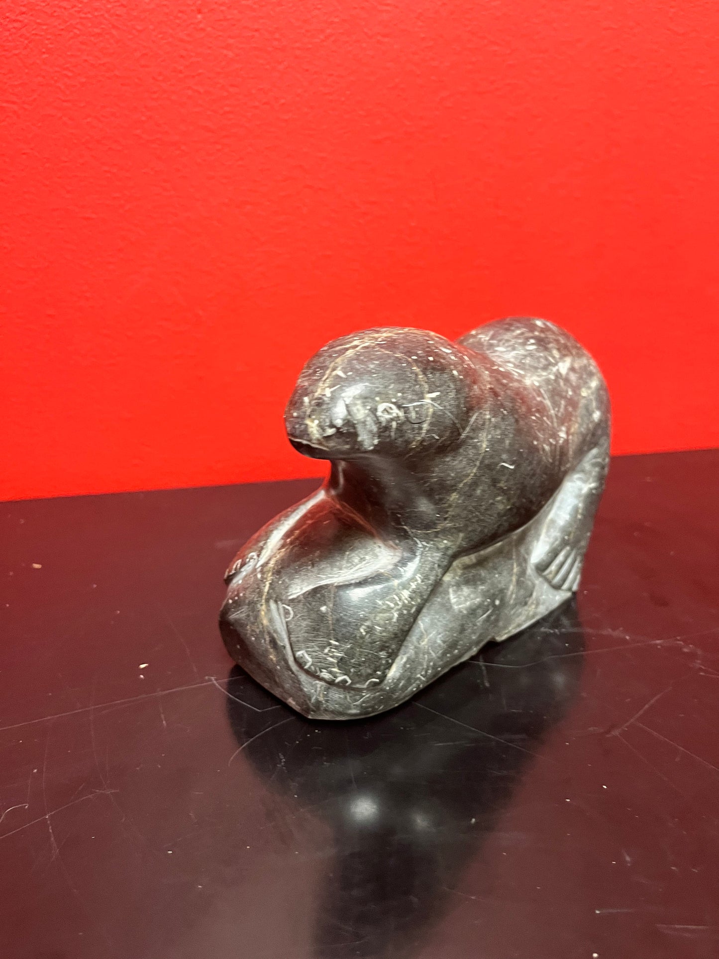 Antique indigenous Inuit, 7 x 4 stunning, soapstone hunting seal  with sticker and number  wow  good antique condition
