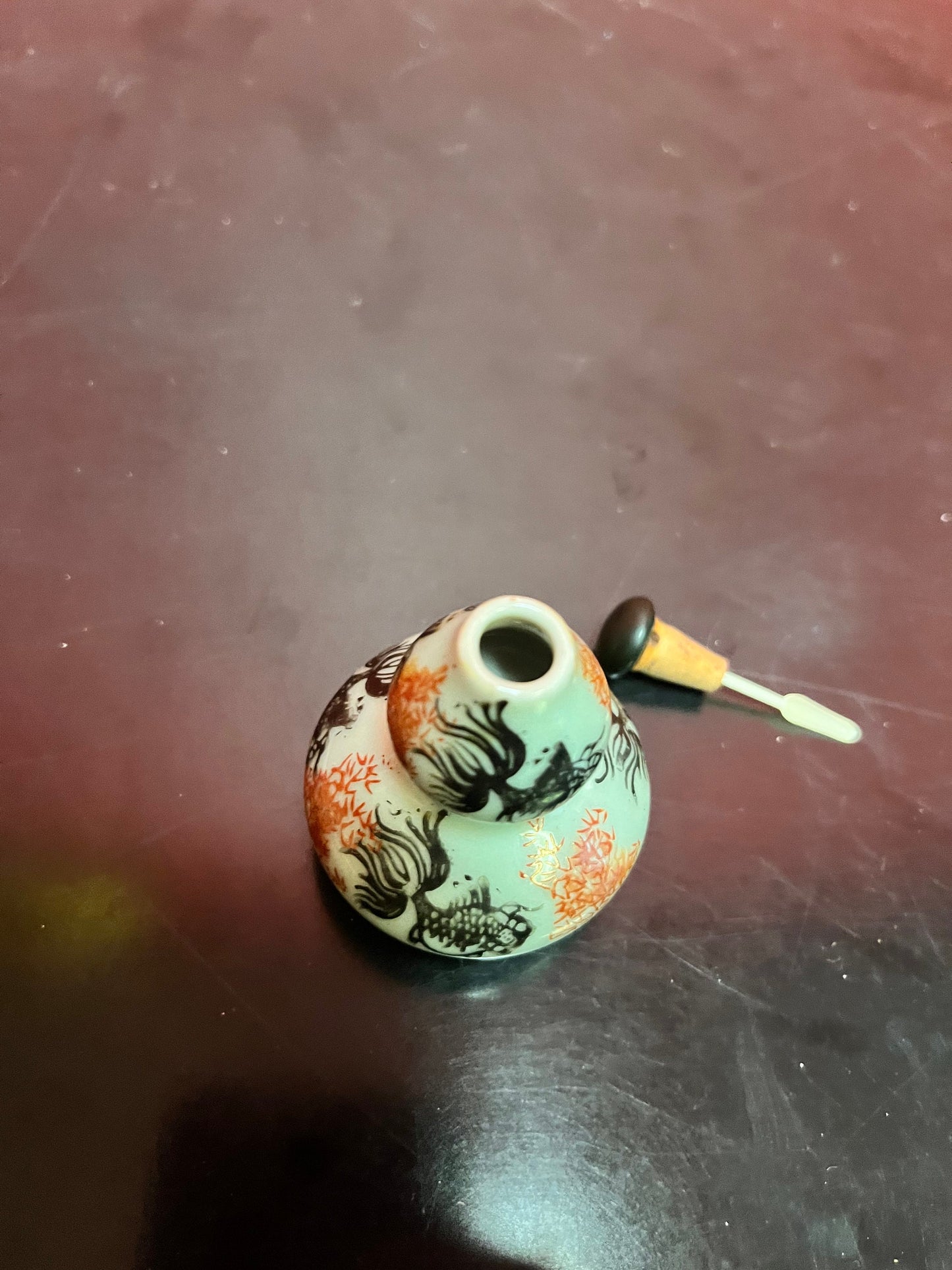 An  Antique Chinese 3 inch high double barrelled porcelain snuff bottle with koi fish and flowers - great value