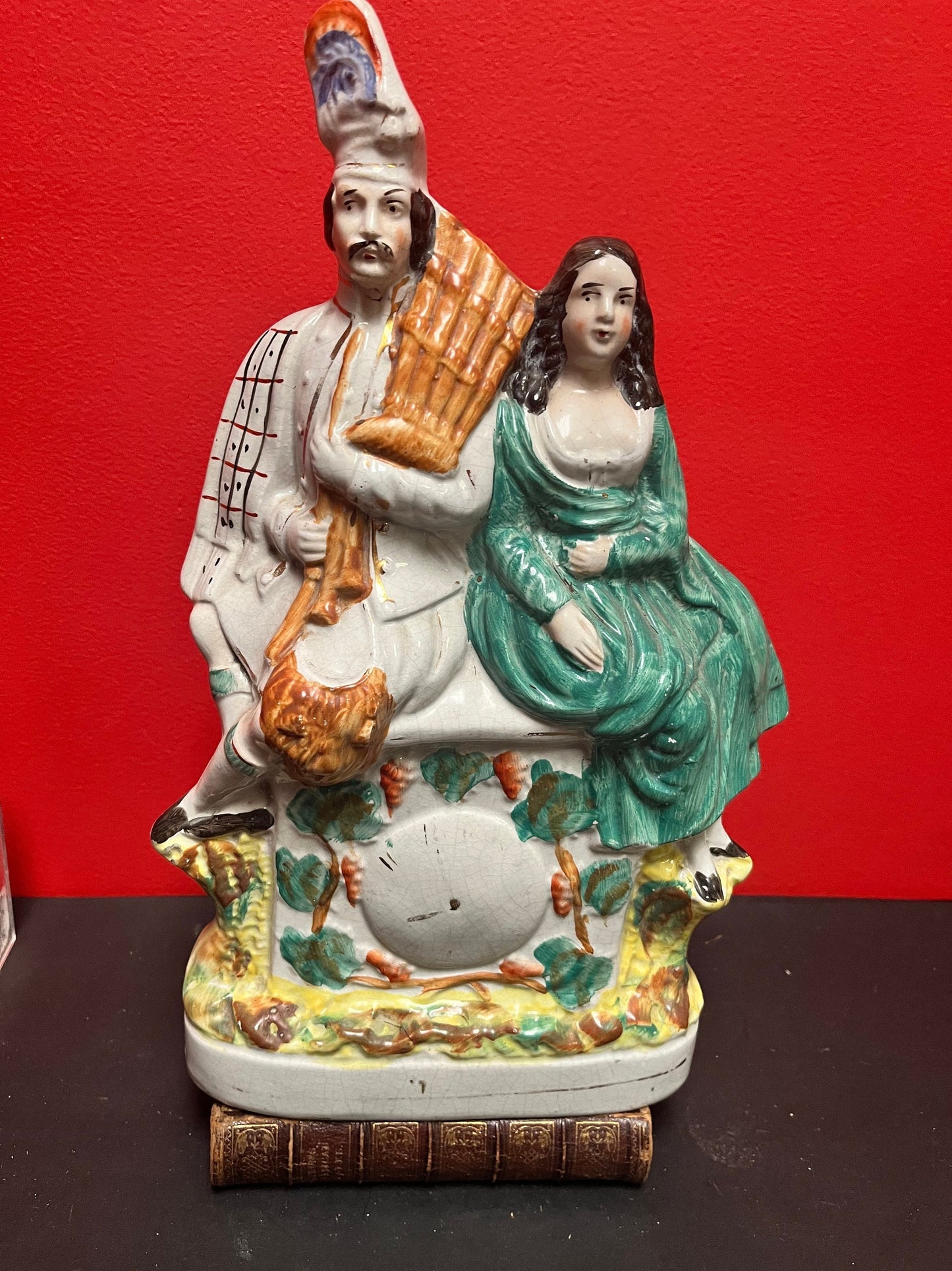 A fabulous, 15 inch high authentic English Staffordshire statue of a couple seated upon a clock  crazing - wow