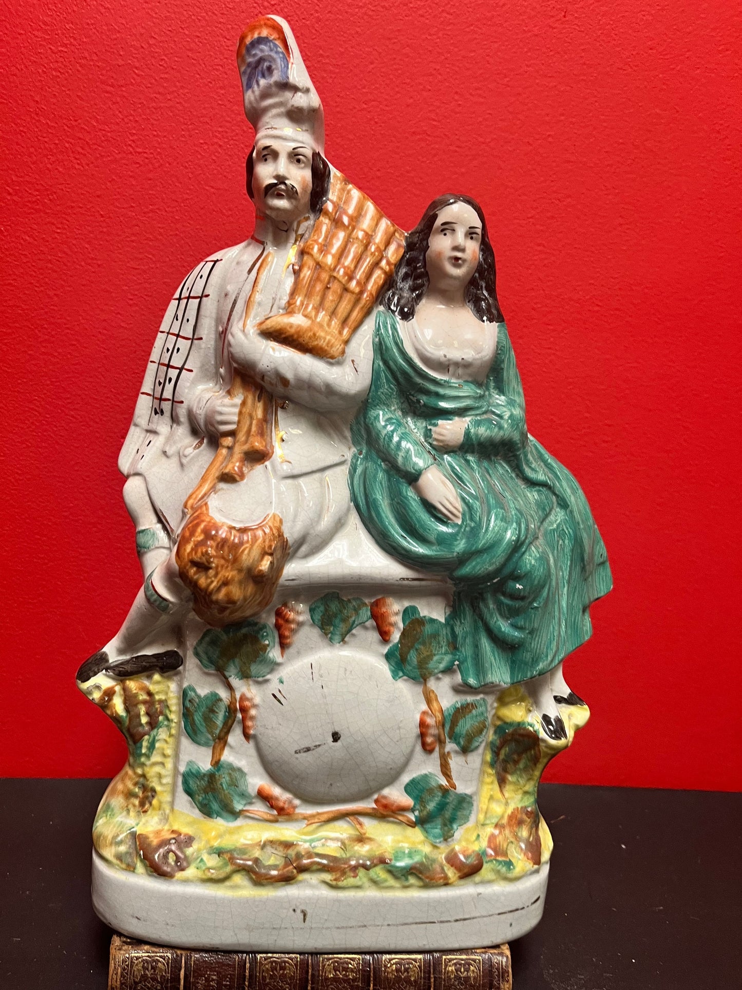 A fabulous, 15 inch high authentic English Staffordshire statue of a couple seated upon a clock  crazing - wow