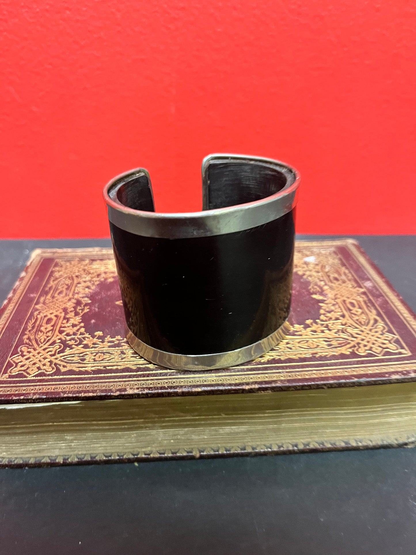 A  3 inch wide silver and horn cool bangle cuff  fits a fairly normal wrist