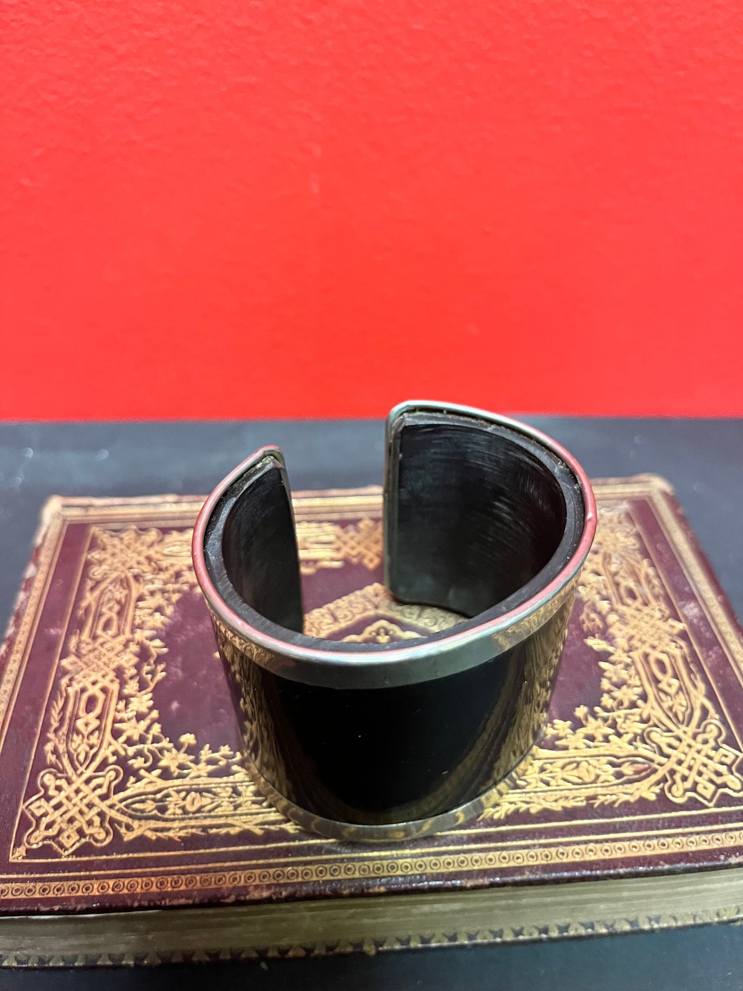 A  3 inch wide silver and horn cool bangle cuff  fits a fairly normal wrist