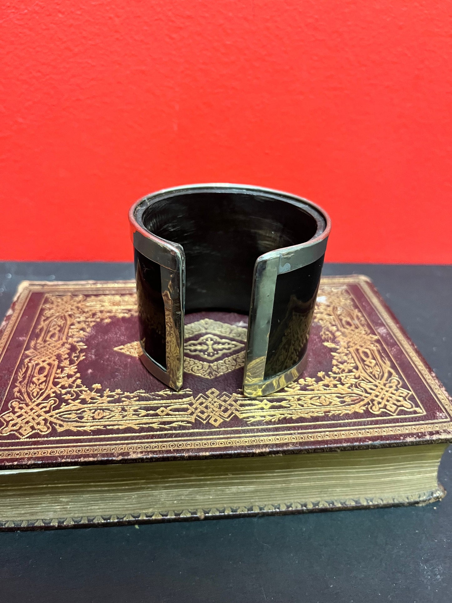 A  3 inch wide silver and horn cool bangle cuff  fits a fairly normal wrist