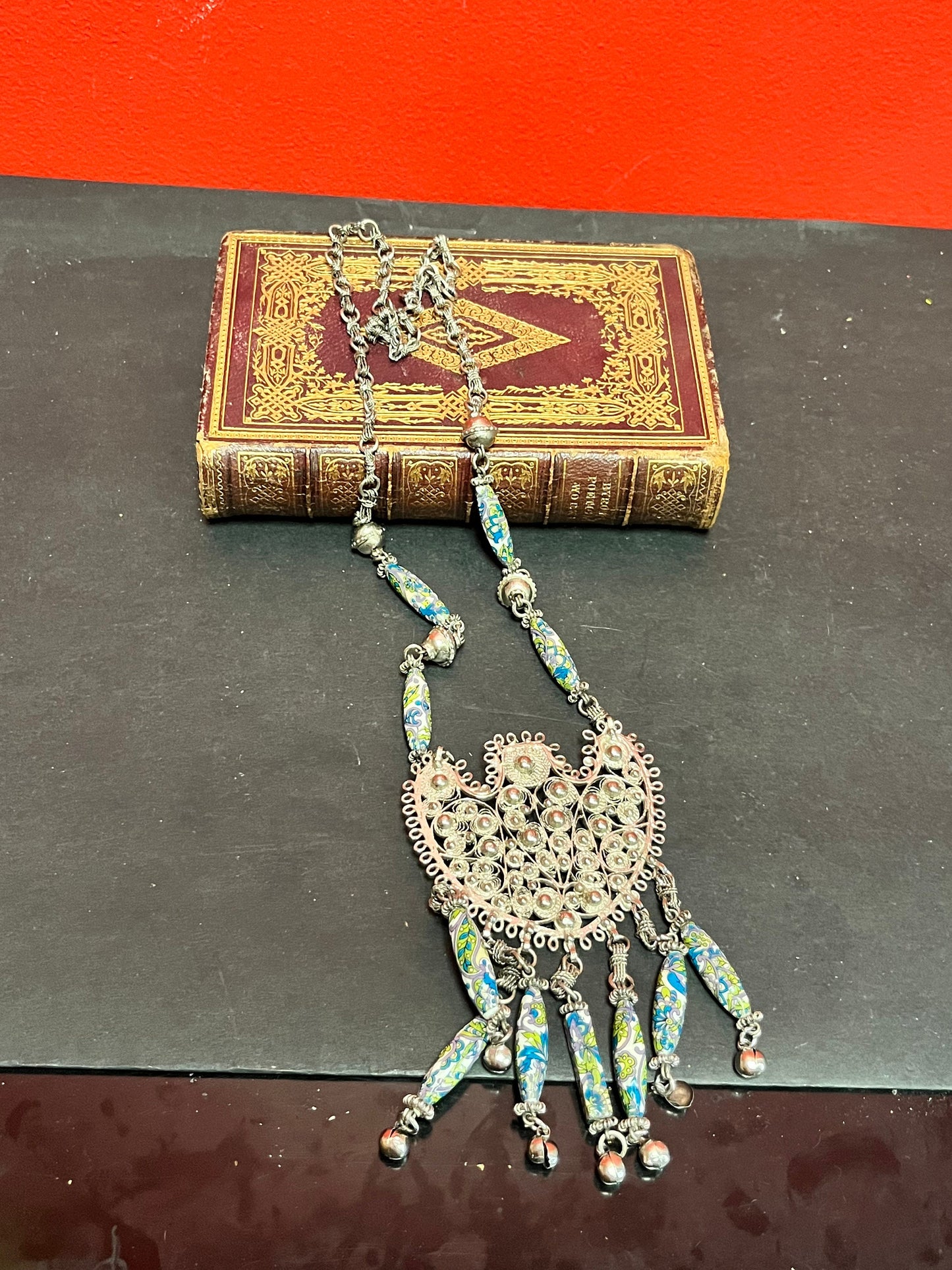 Approximately 26 inch necklace with 6 inch pendant  Asian silver filagree and pottery beads  very unusual and wonderful