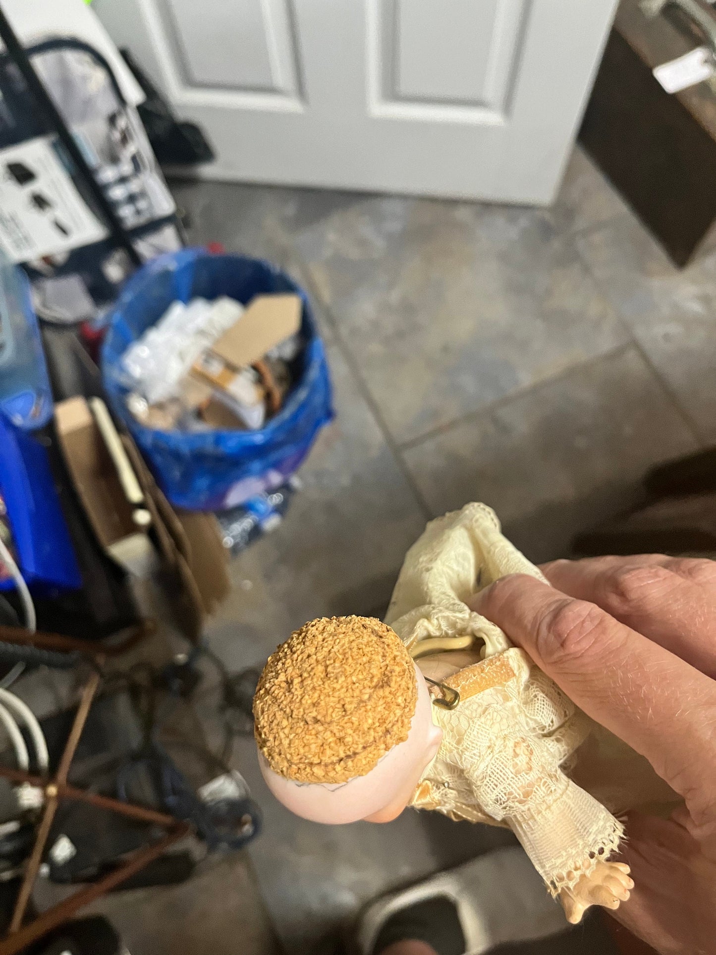 8 1/2 inch Victorian porcelain doll with original clothes on stand