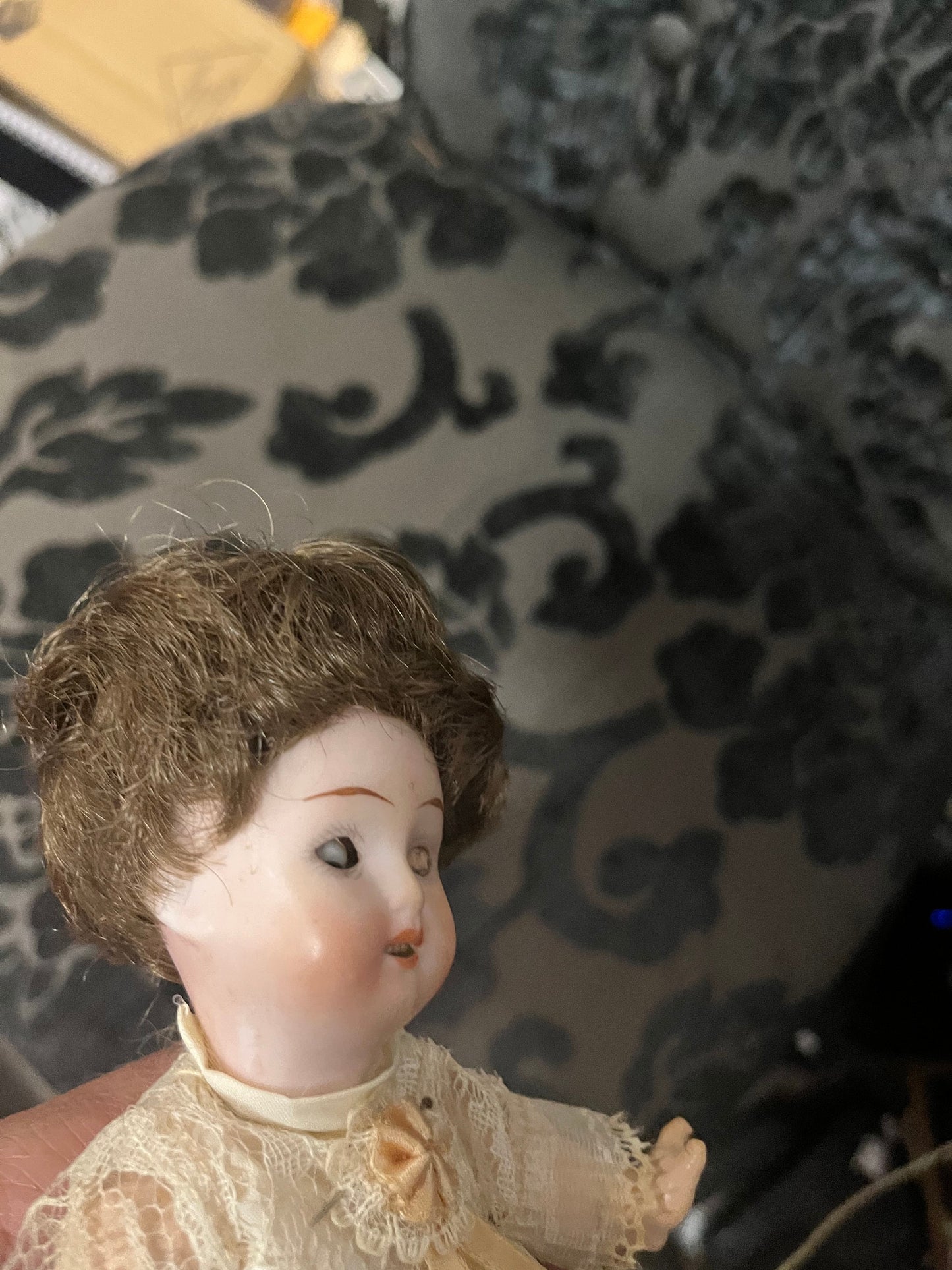 8 1/2 inch Victorian porcelain doll with original clothes on stand