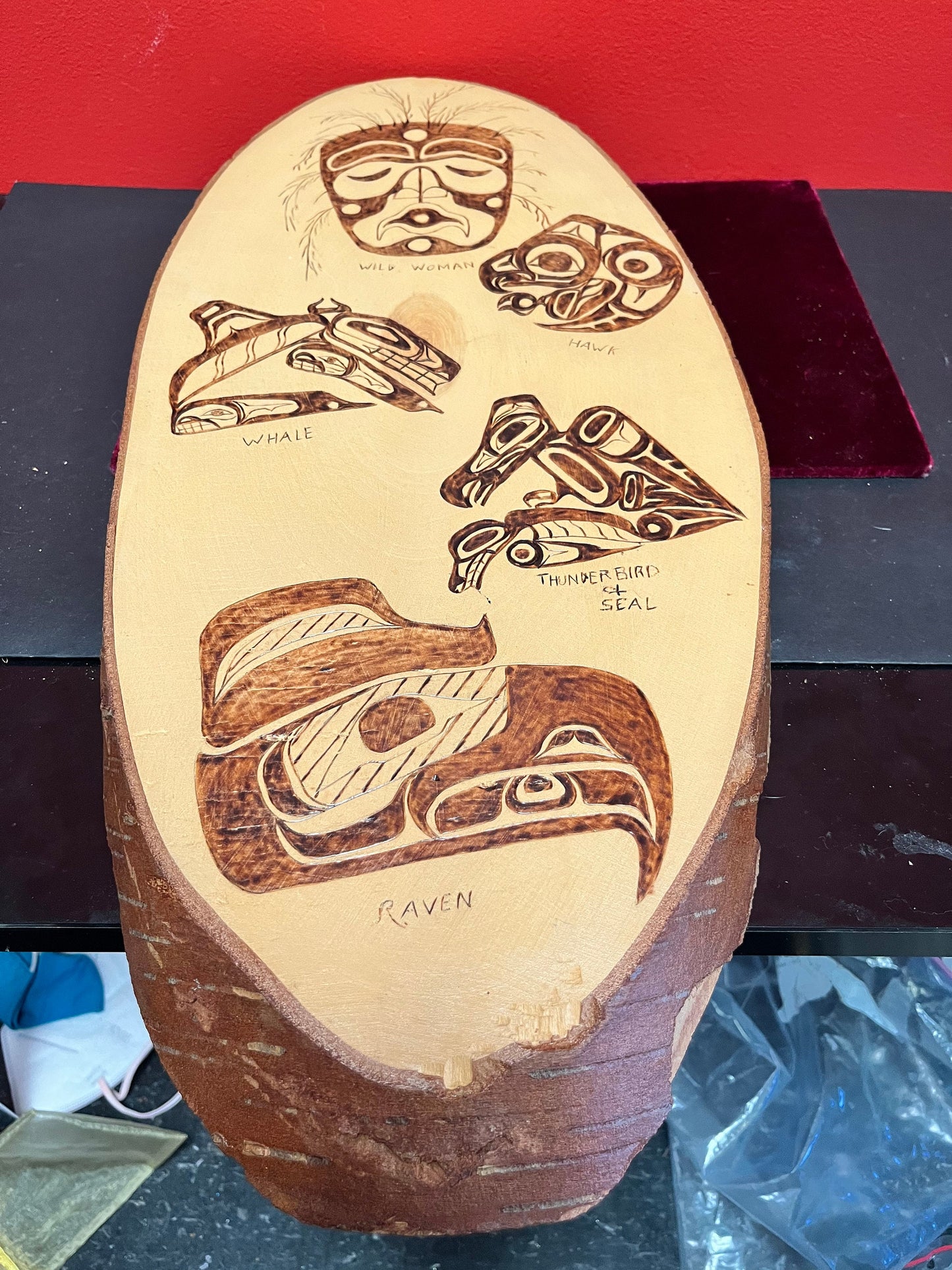 A 21 x 10 live edge, wood indigenous, first nations pacific northwest coast plaque  collaboration piece signed on back