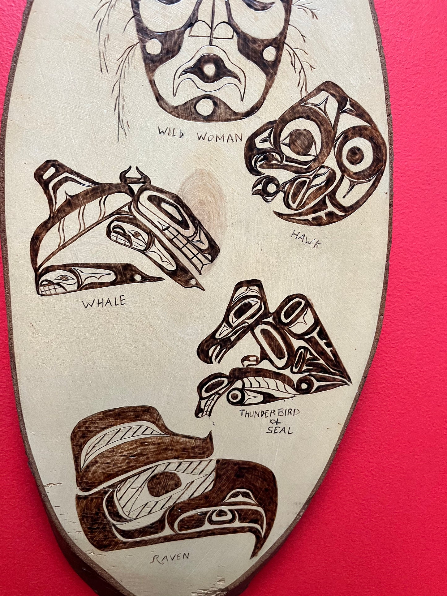 A 21 x 10 live edge, wood indigenous, first nations pacific northwest coast plaque  collaboration piece signed on back