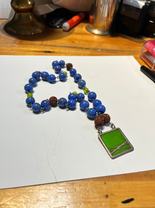 Approx 17 inch glass bead necklace with 1 inch cool pendant great gift