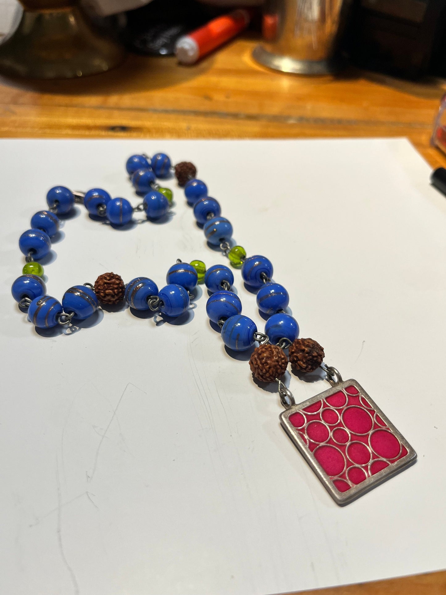 Approx 17 inch glass bead necklace with 1 inch cool pendant great gift