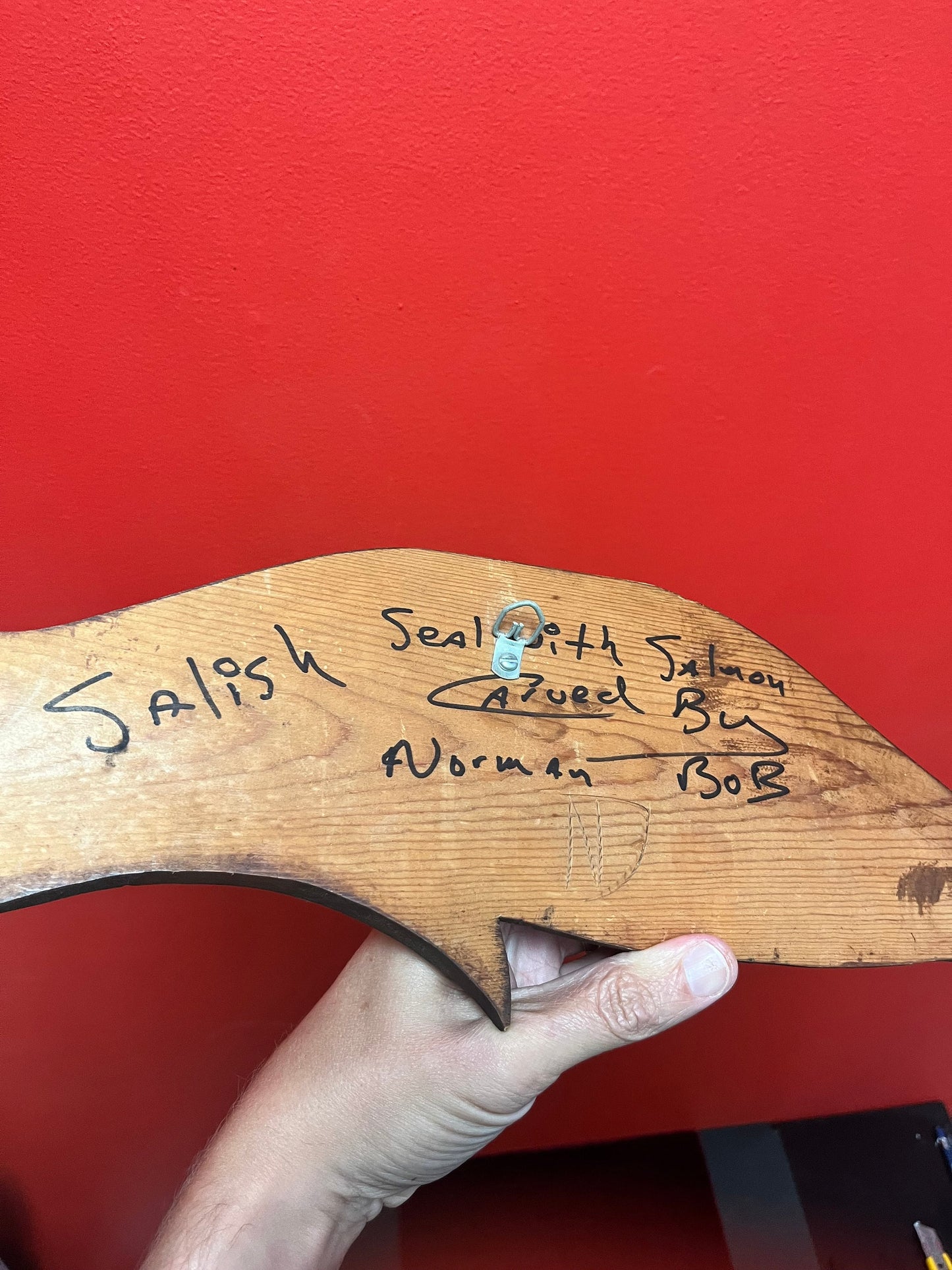 20 x 6 wide Indigenous First Nations Salish signed seal eating a salmon by Norman Bob