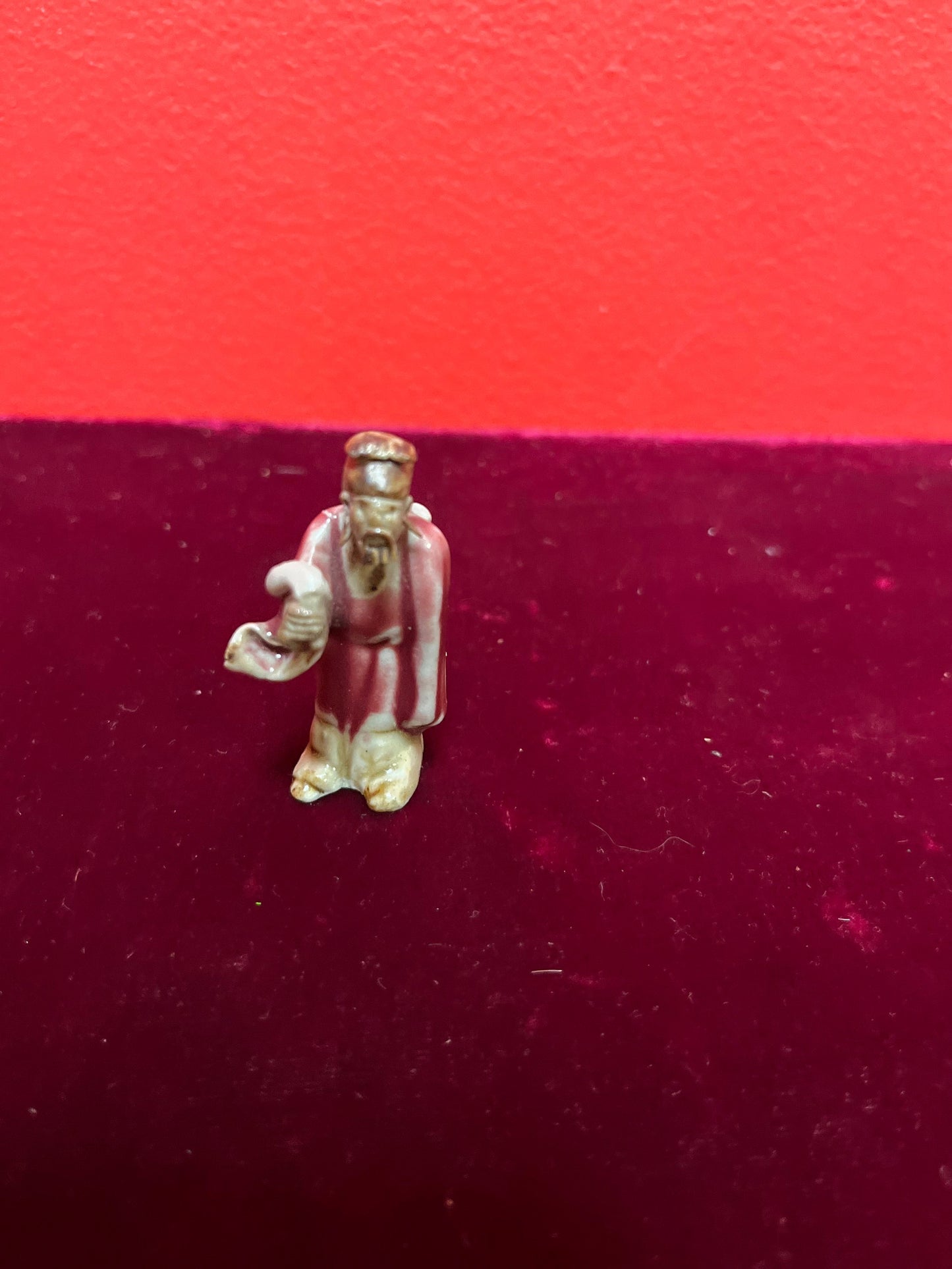 A  Fabulous 2 inch tall sang de boeuf mud man   incredible detail and fabulous condition - wow