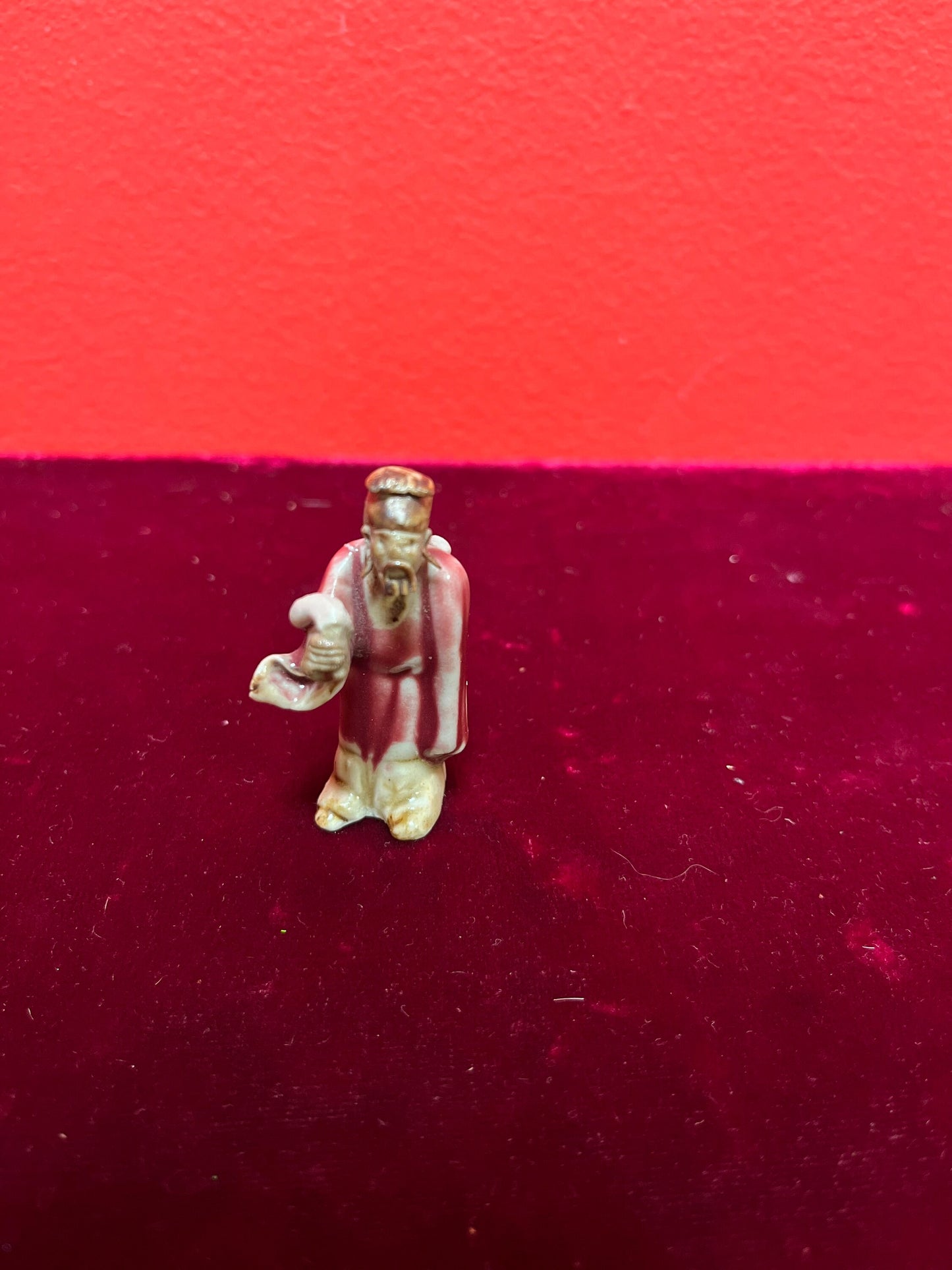 A  Fabulous 2 inch tall sang de boeuf mud man   incredible detail and fabulous condition - wow