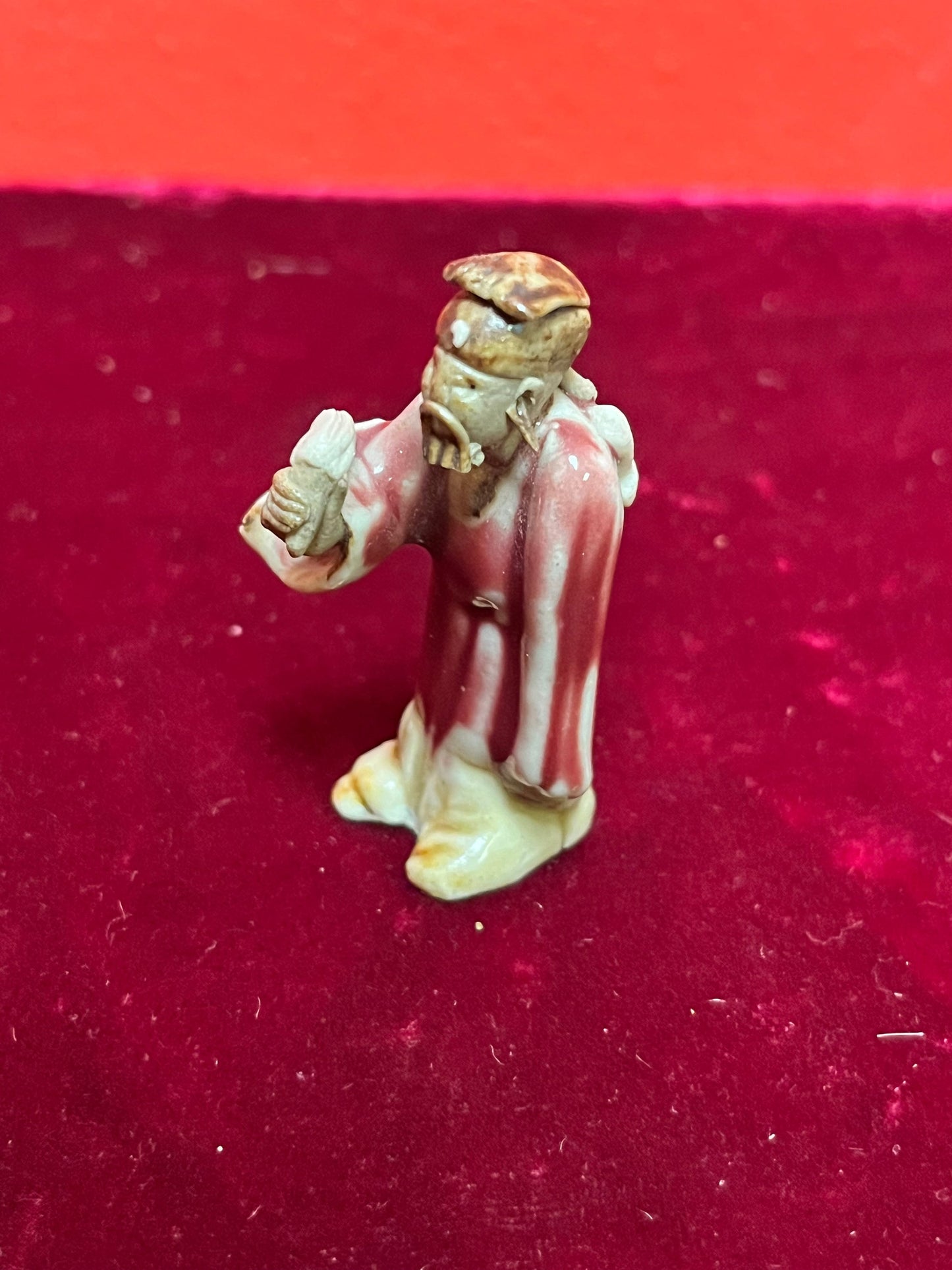 A  Fabulous 2 inch tall sang de boeuf mud man   incredible detail and fabulous condition - wow