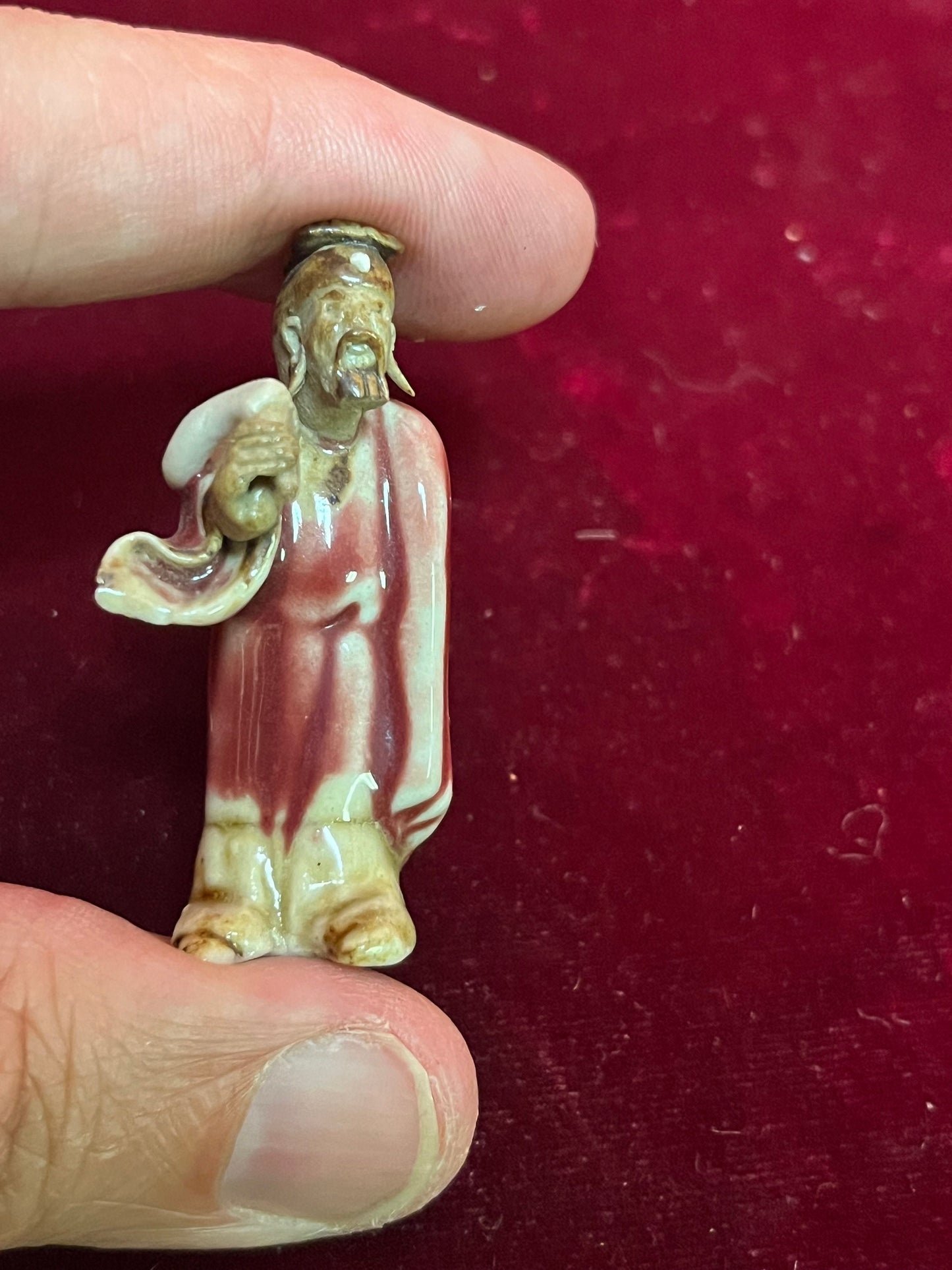 A  Fabulous 2 inch tall sang de boeuf mud man   incredible detail and fabulous condition - wow