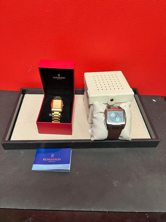 Two designer watches in boxes   both seem to work, but need battery  sold as is  final sale  killer deal