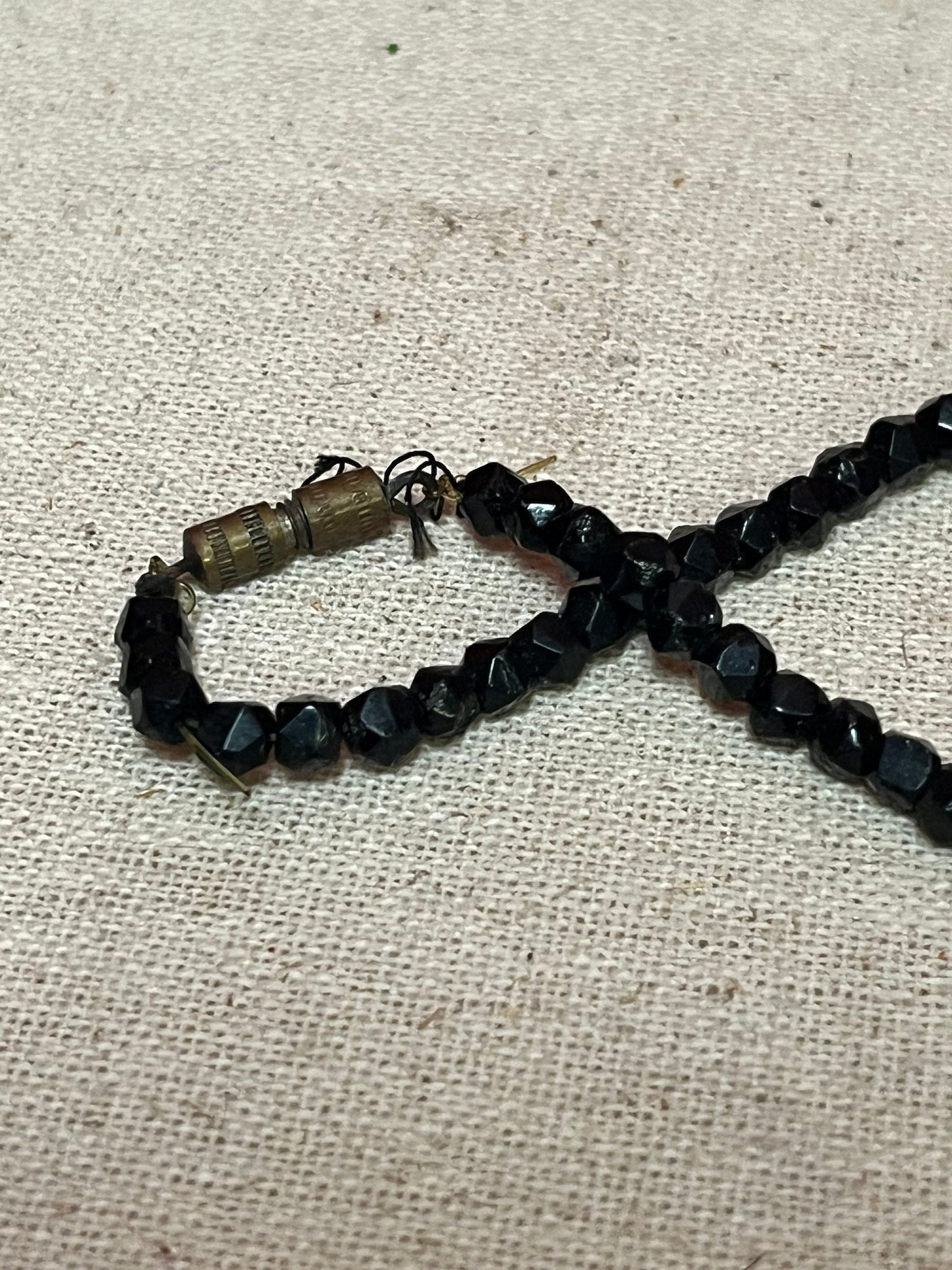 Stunning approximately 25 inch long, jet black beard necklace with a 3 inch long bronze crucifix pendant  very cool