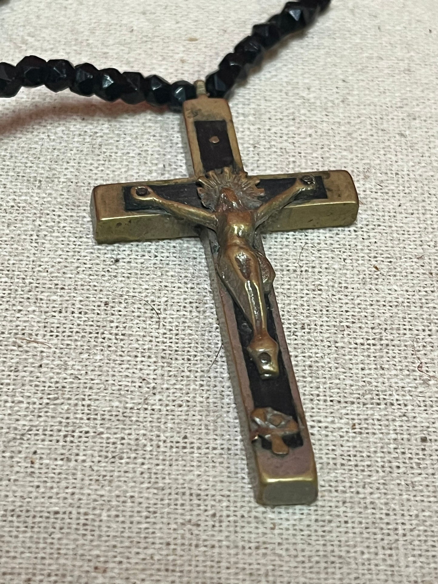 Stunning approximately 25 inch long, jet black beard necklace with a 3 inch long bronze crucifix pendant  very cool