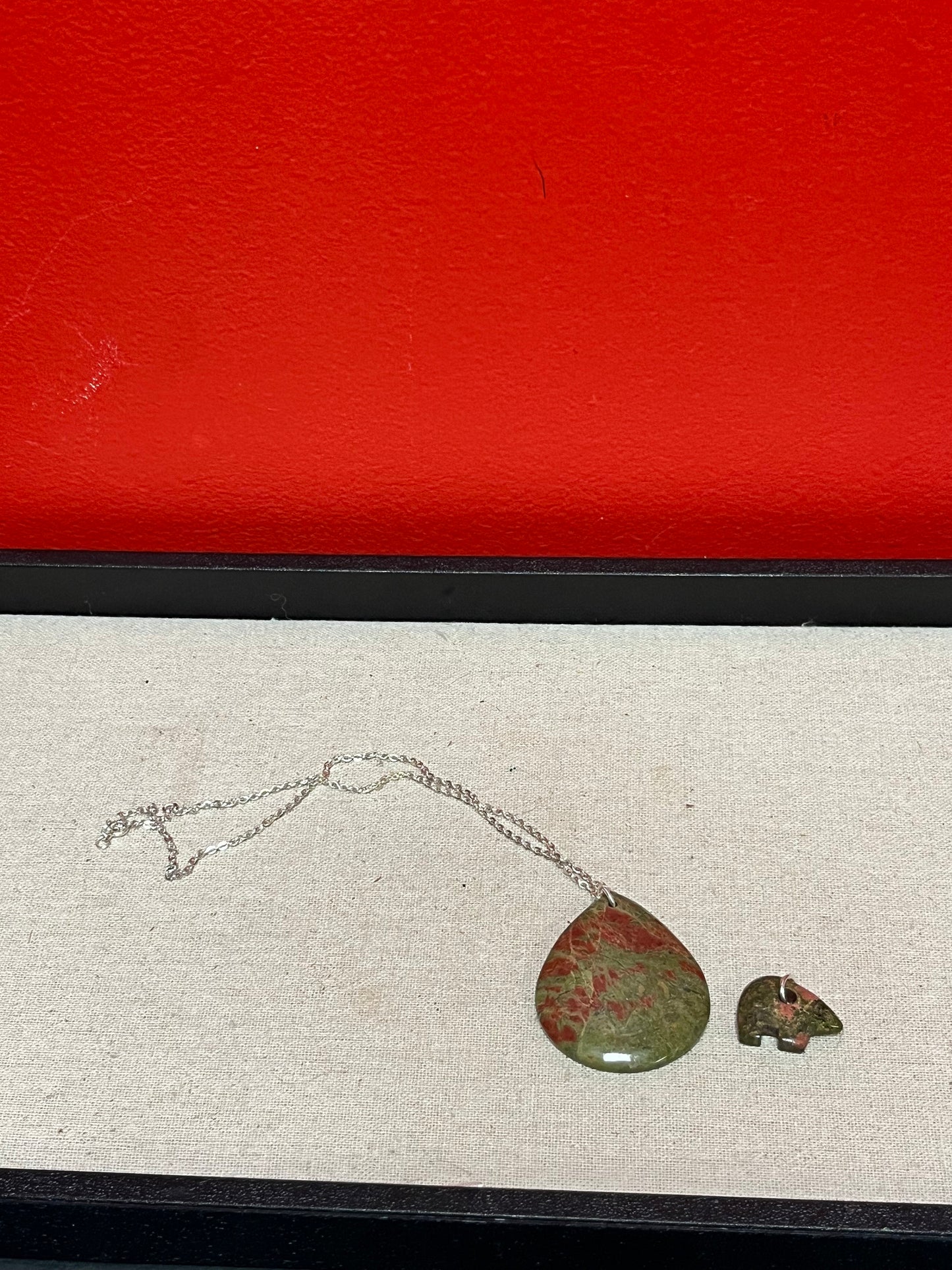 A  Beautiful  unakite pendant with silver necklace and extra bear pendant  pendant is 2 1/2 inches long  great gifts