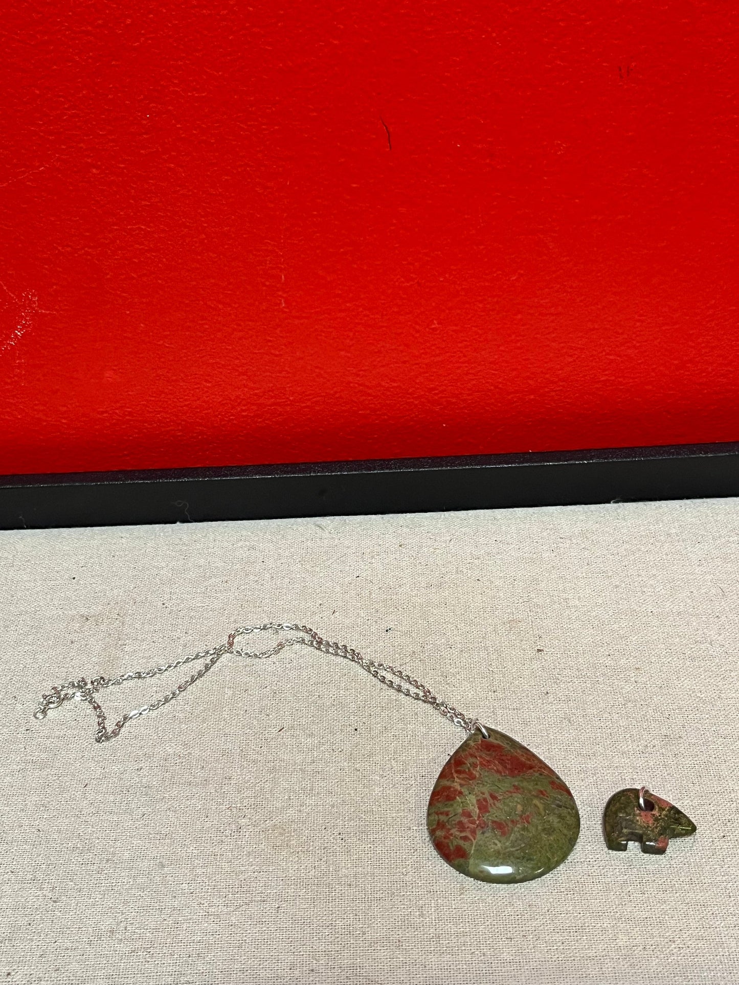 A  Beautiful  unakite pendant with silver necklace and extra bear pendant  pendant is 2 1/2 inches long  great gifts