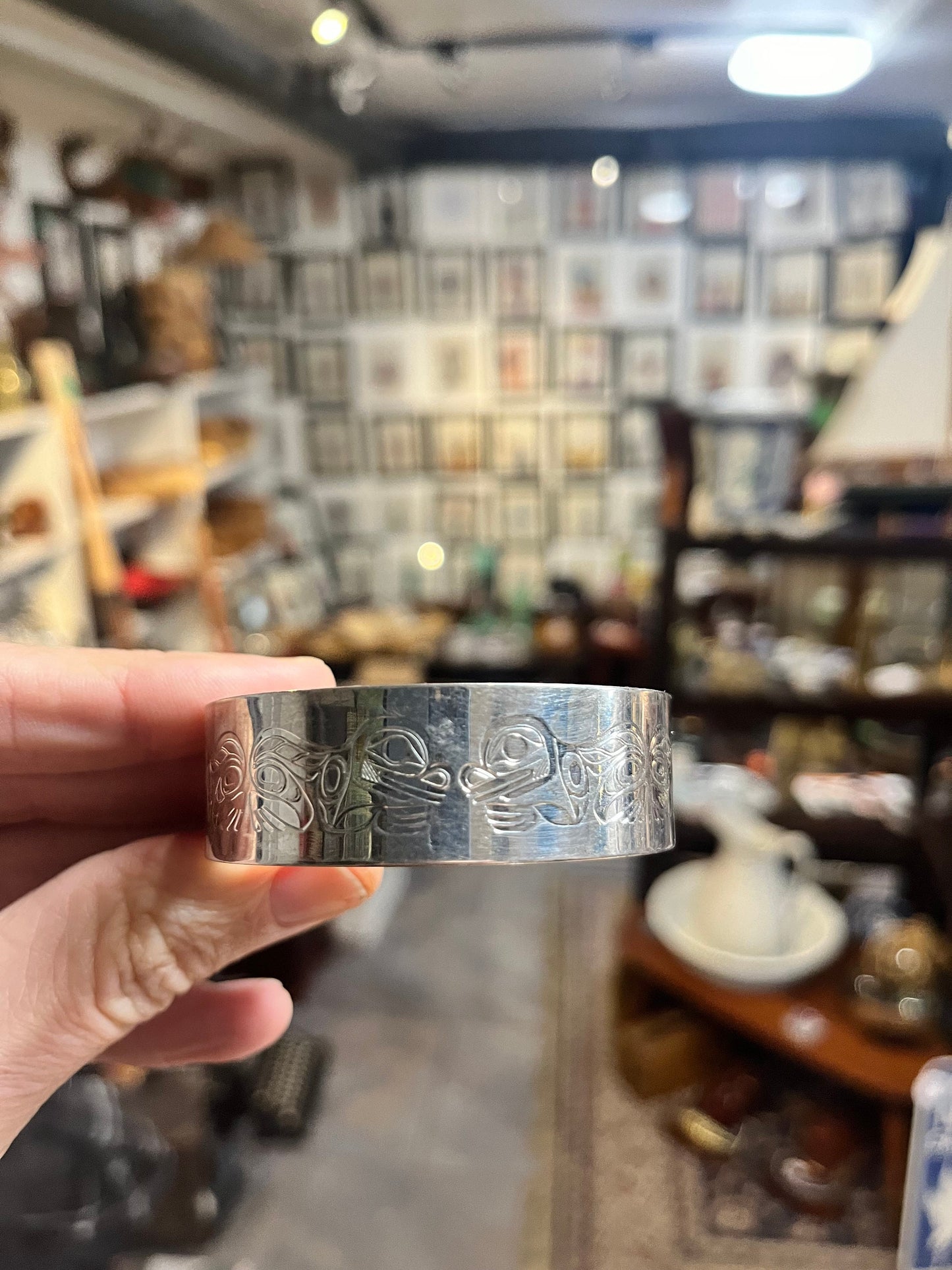 Absolutely stunning 2.25 inch wide indigenous first nation specific north west coast signed silver bracelet bangle with great imagery