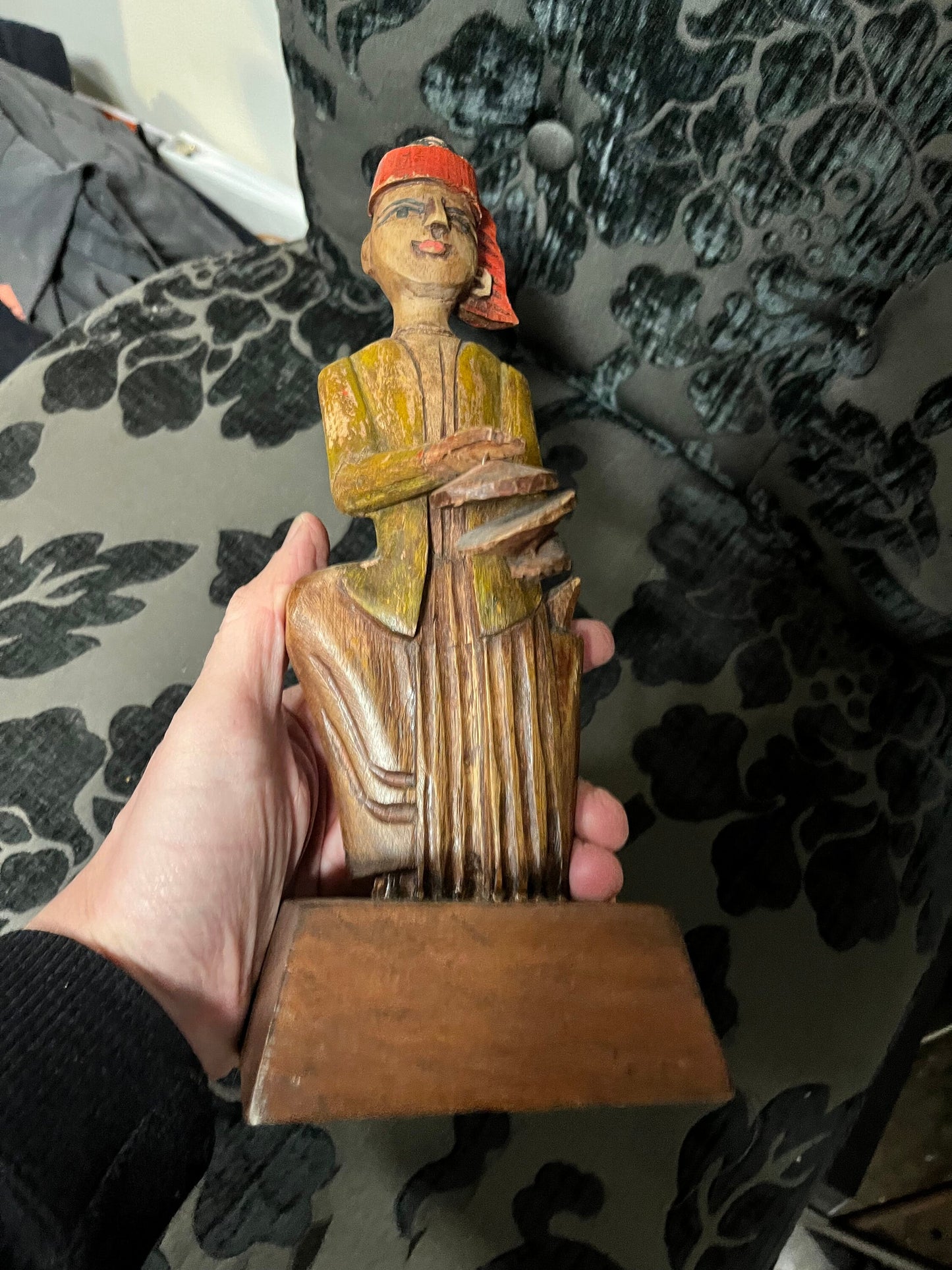 A 11 inch south east wooden statue  stand or hang