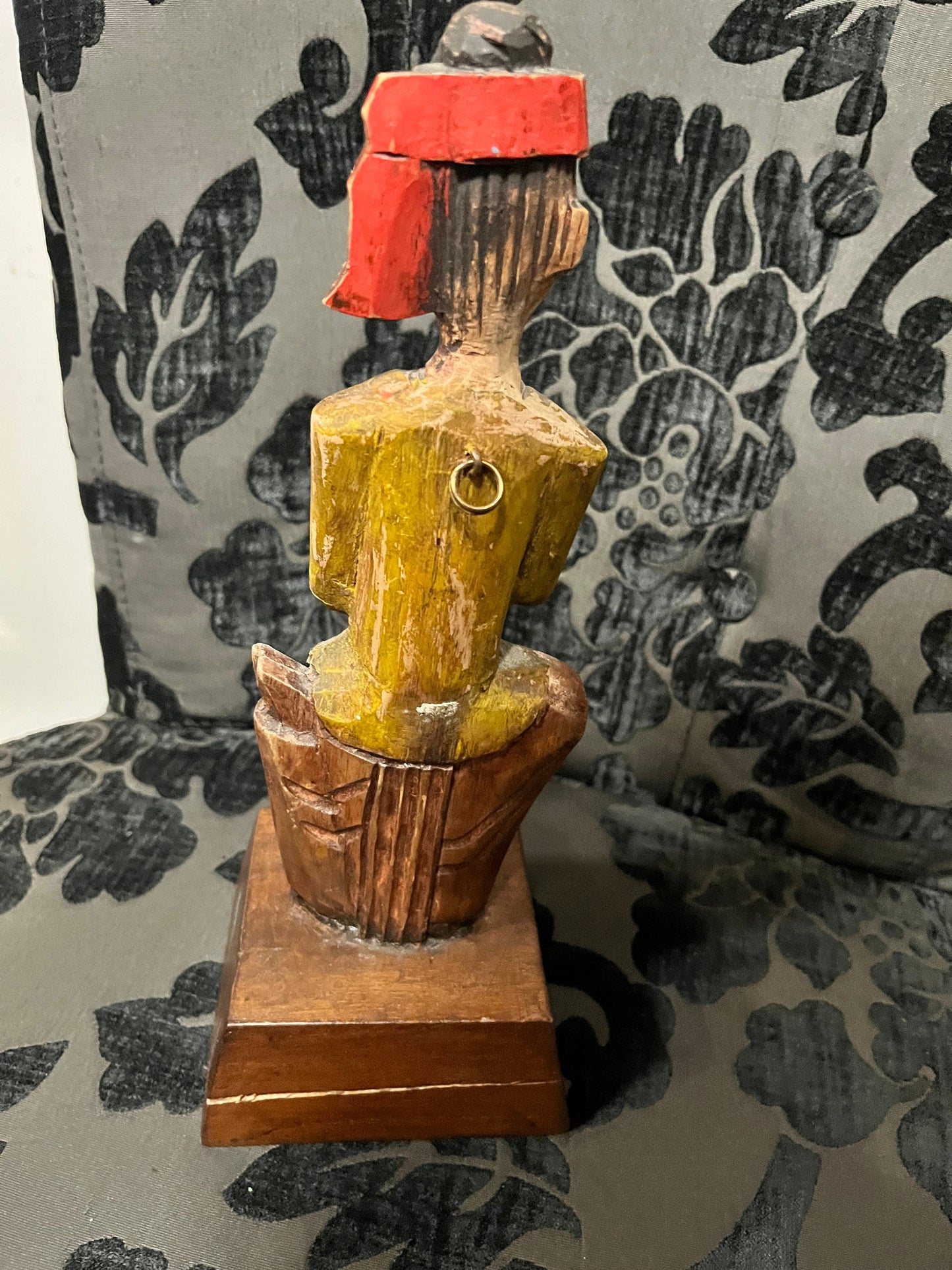 A 11 inch south east wooden statue  stand or hang