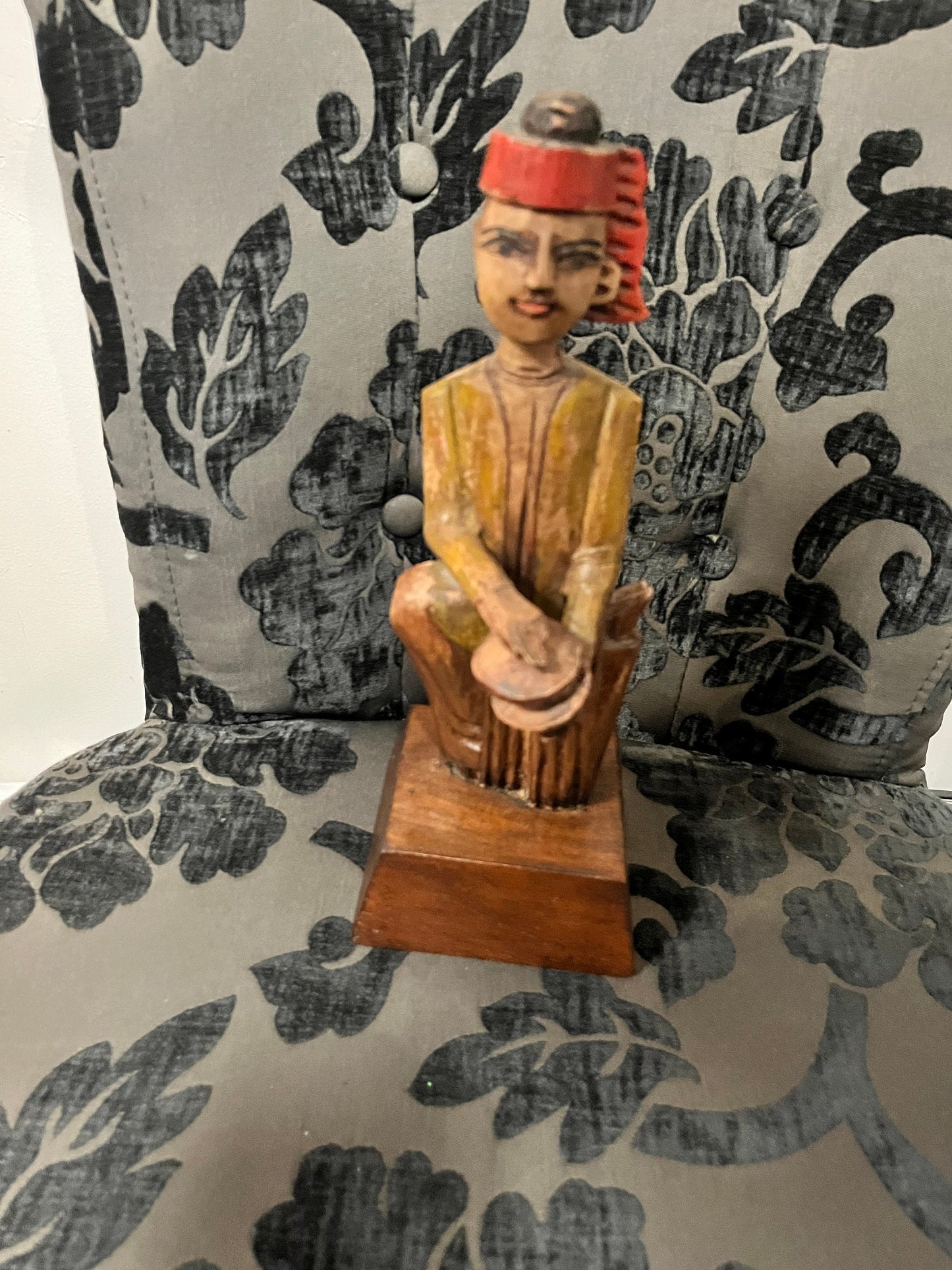 A 11 inch south east wooden statue  stand or hang
