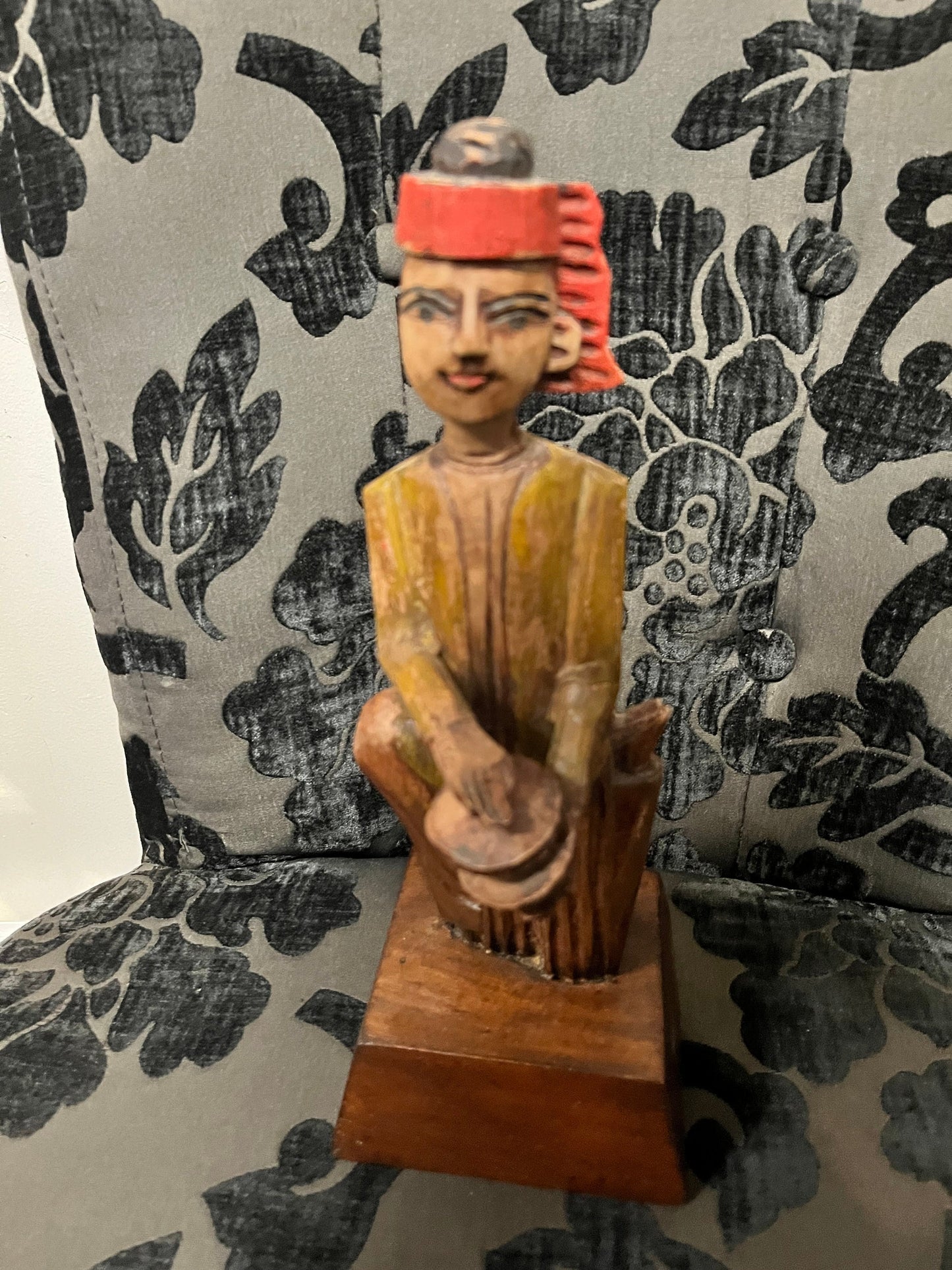 A 11 inch south east wooden statue  stand or hang