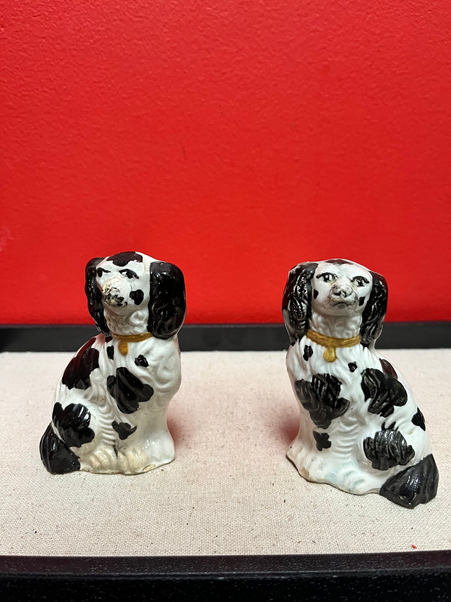 Lovely pair of 19 century Staffordshire spaniels  4 inches high, and in less than perfect condition